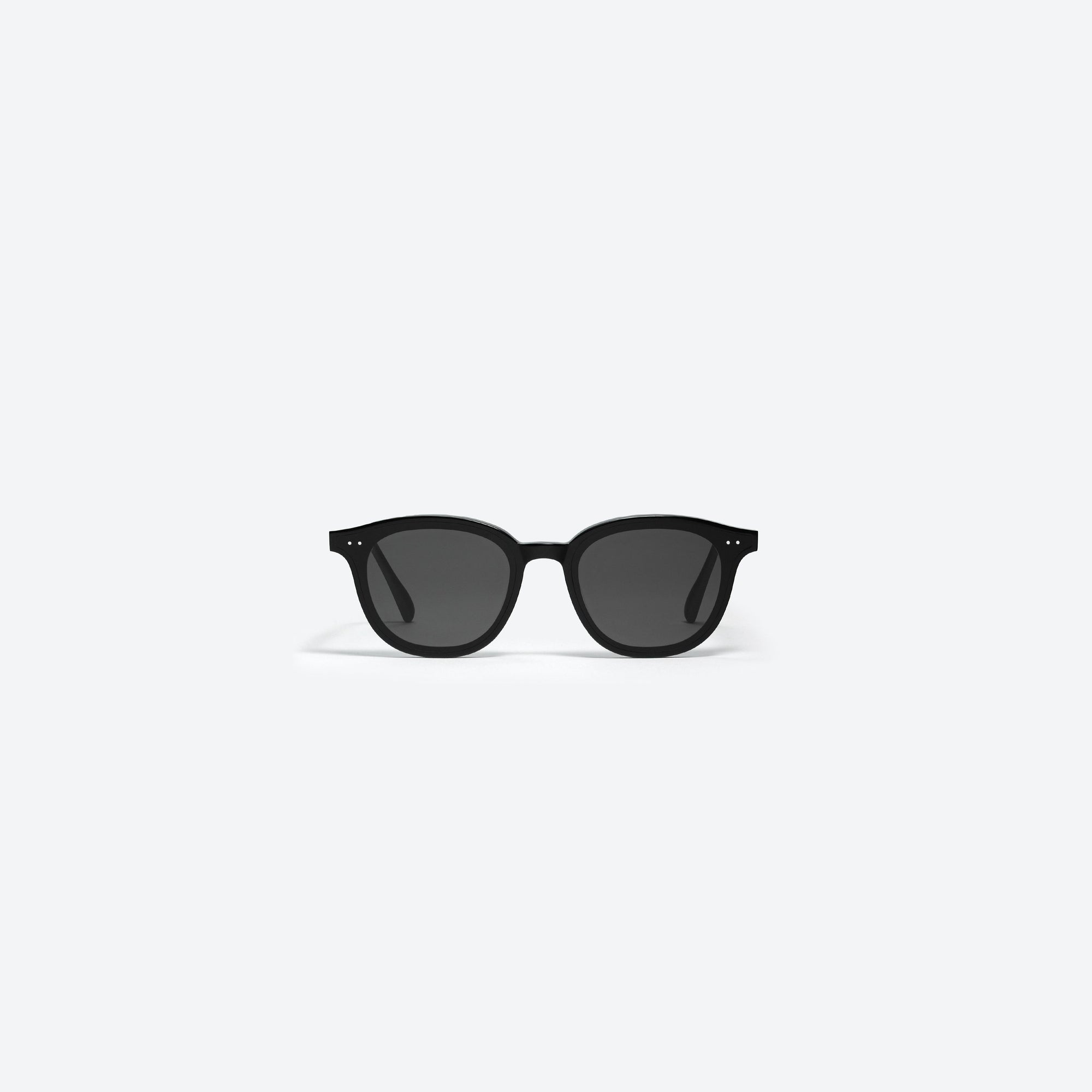 A front view of Gentle Monster Lang 01 Black Acetate framed Round sunglasses.