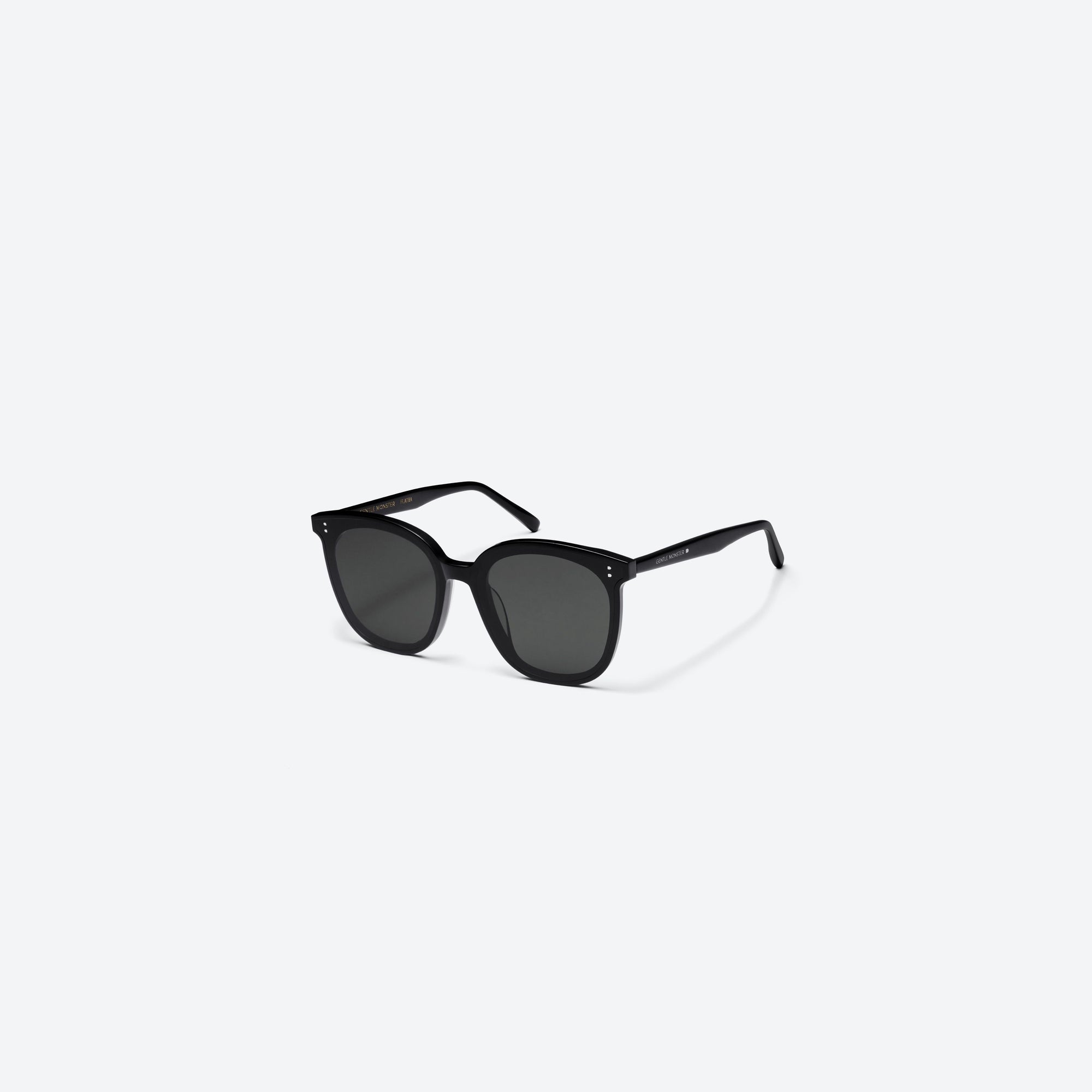 45-degree view of Gentle Monster My Ma 01 Black Acetate framed Square sunglasses.