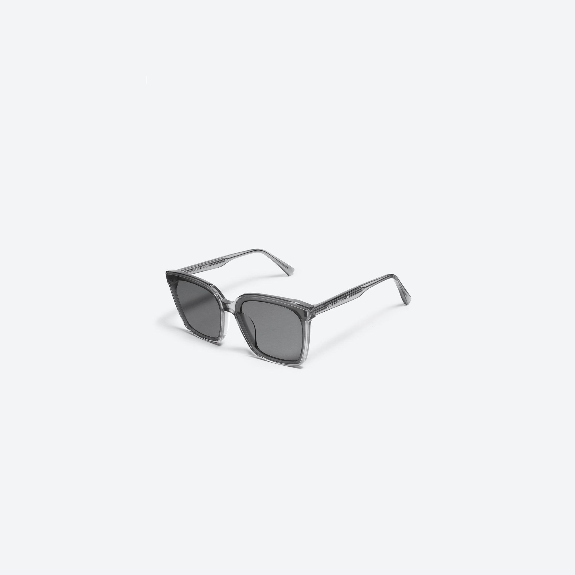 45-degree view of Gentle Monster Tega G1 Gray Acetate framed Square sunglasses.