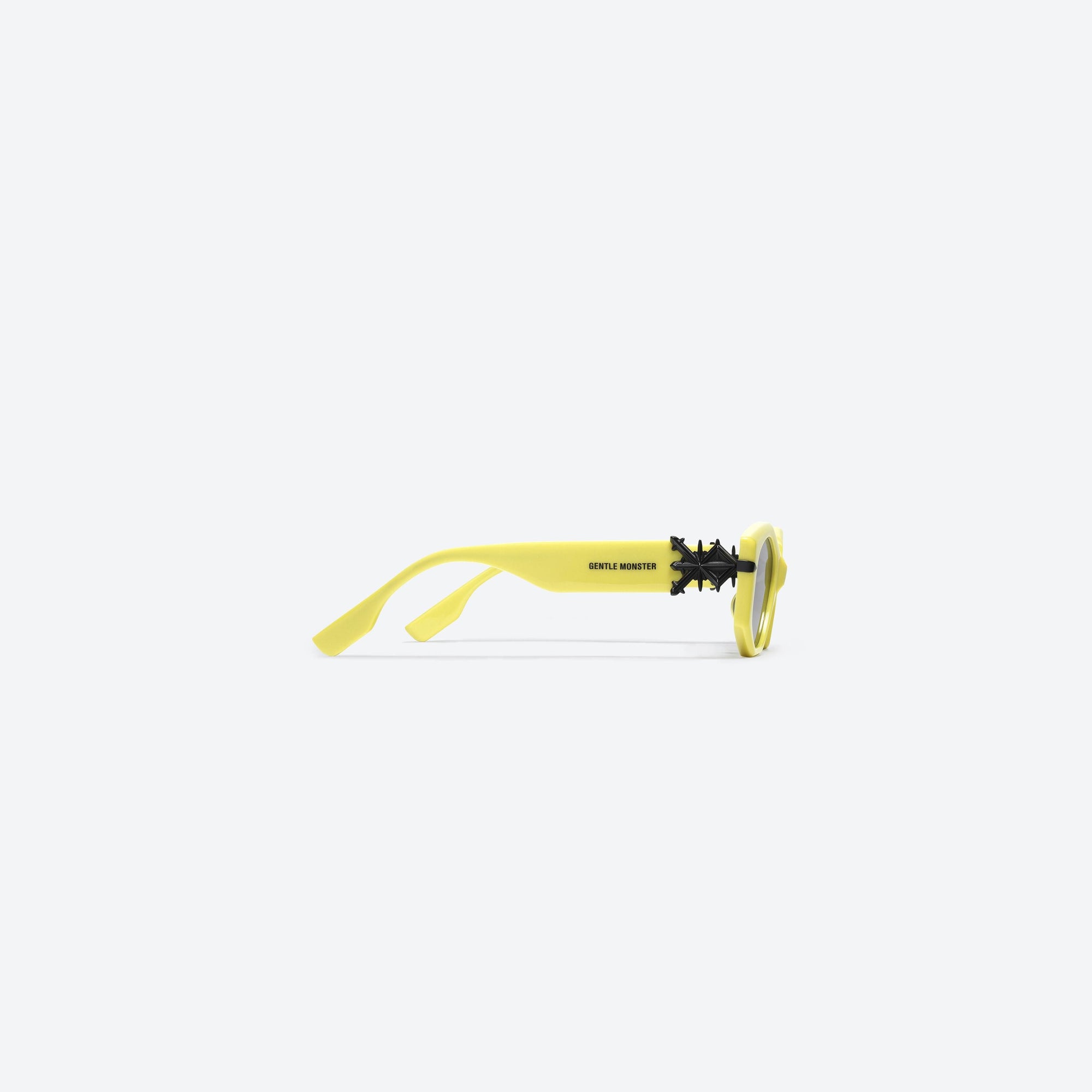 A detailed right view of Gentle Monster SANKUANZ - Cilice YG1 Yellow Acetate framed Cat-eye sunglasses.