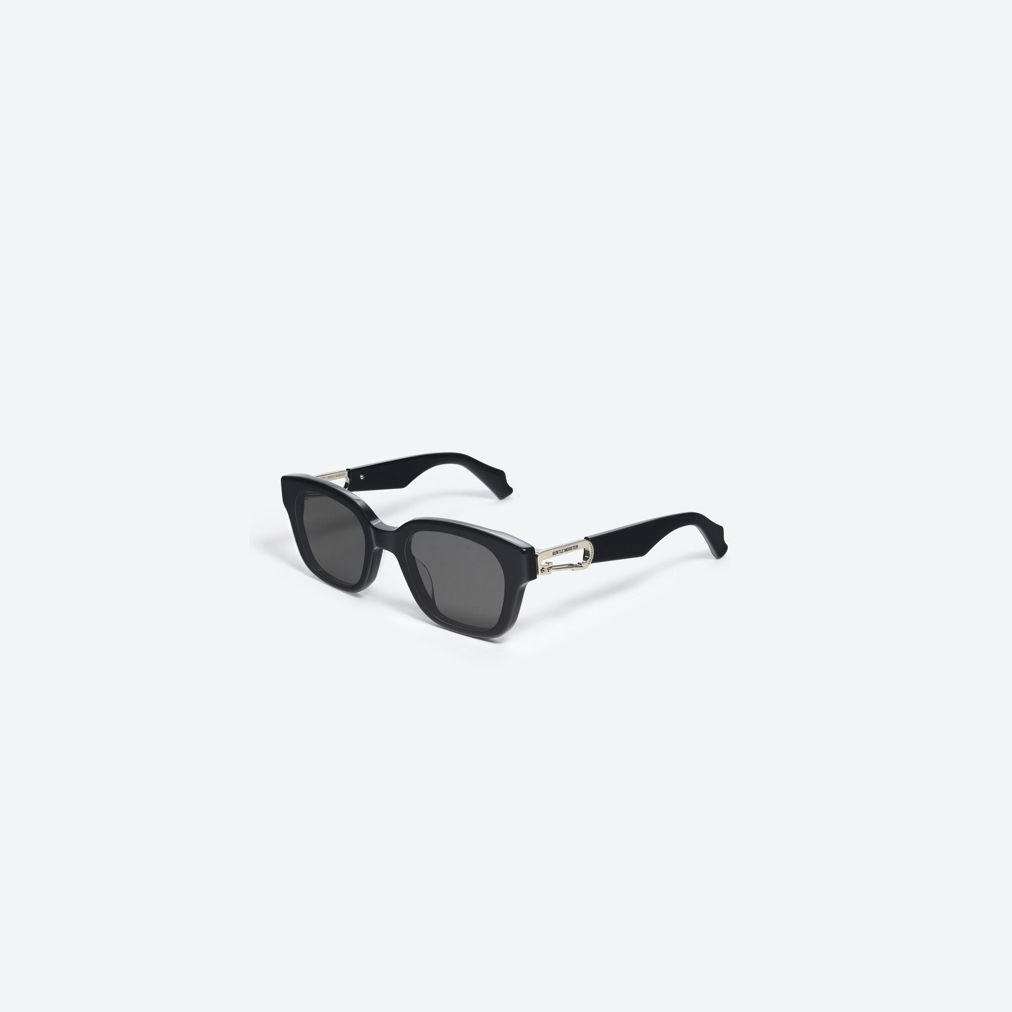 45-degree view of Gentle Monster Ambush - Carabiner 1 01 Black Mixed framed Square sunglasses.