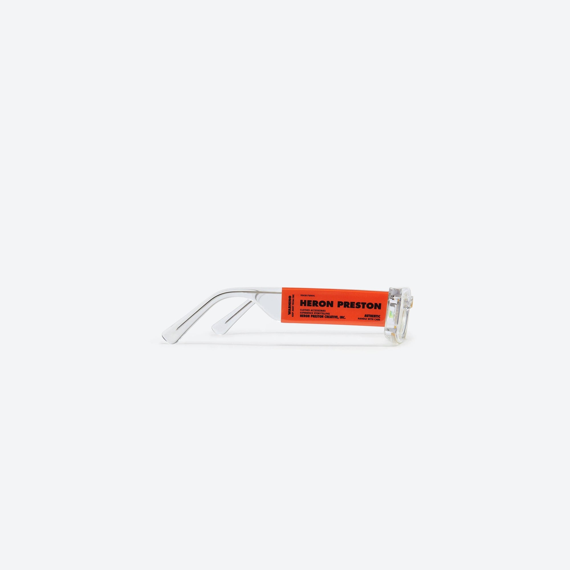 A detailed right view of Gentle Monster Heron Preston - Level 0 C1 Clear Acetate framed Square sunglasses.