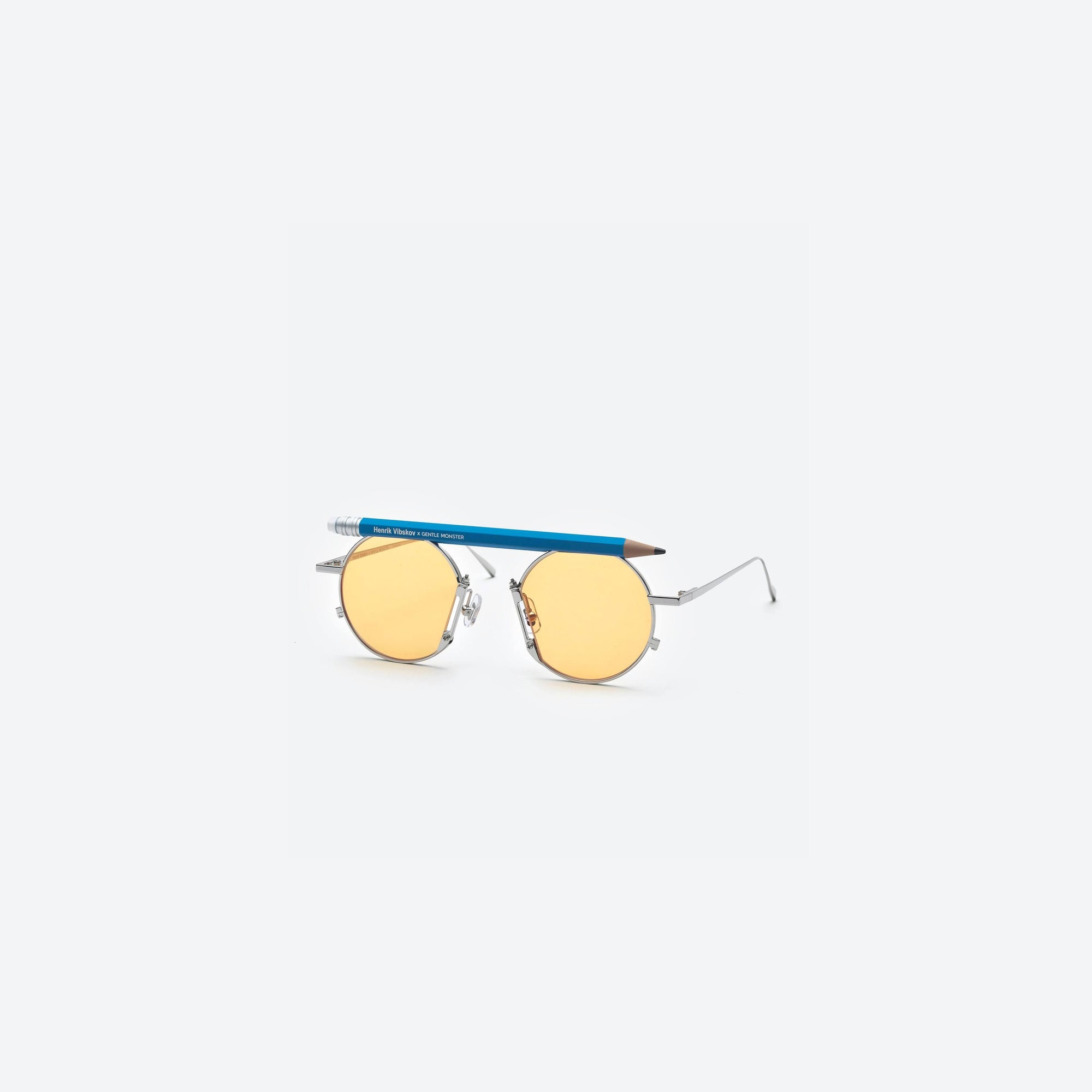 45-degree view of Gentle Monster Henrik Vibskov - Pencil Glasses Blue Pen Silver Metal framed Round sunglasses.
