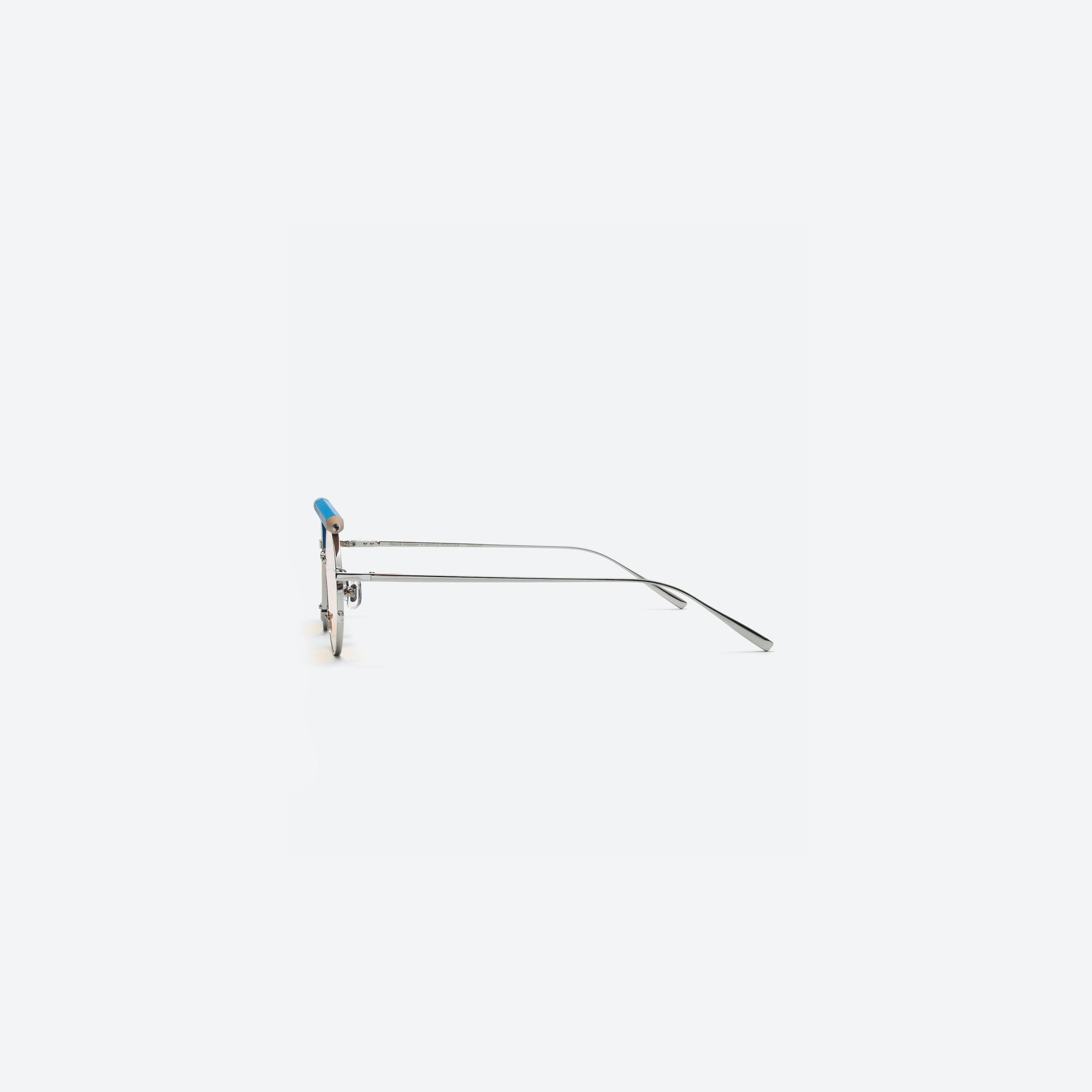 A detailed right view of Gentle Monster Henrik Vibskov - Pencil Glasses Blue Pen Silver Metal framed Round sunglasses.