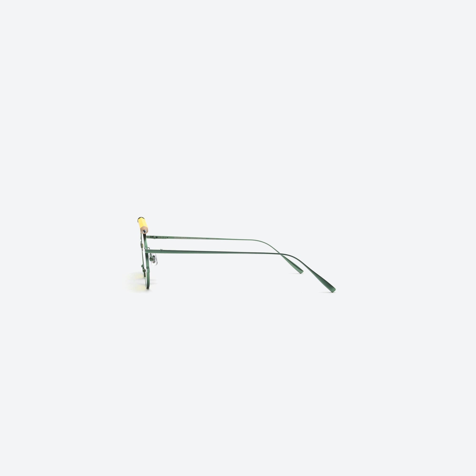 A detailed right view of Gentle Monster Henrik Vibskov - Pencil Glasses Yellow Pen Green Metal framed Round sunglasses.