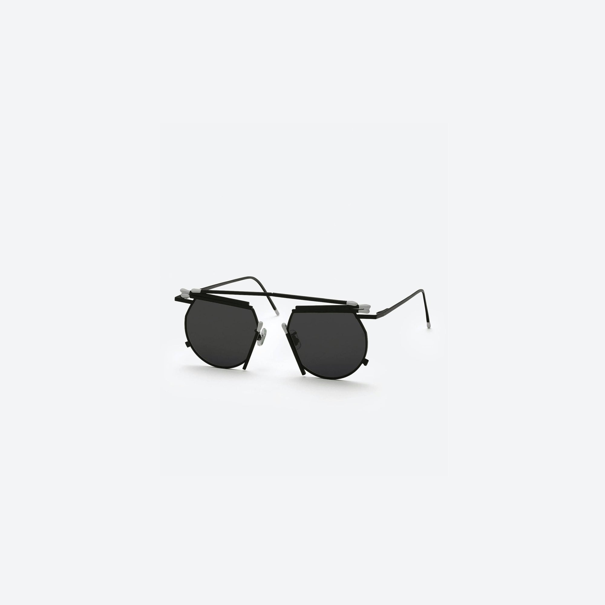 45-degree view of Gentle Monster Henrik Vibskov - Matches Glasses M01 Black Metal framed Round sunglasses.