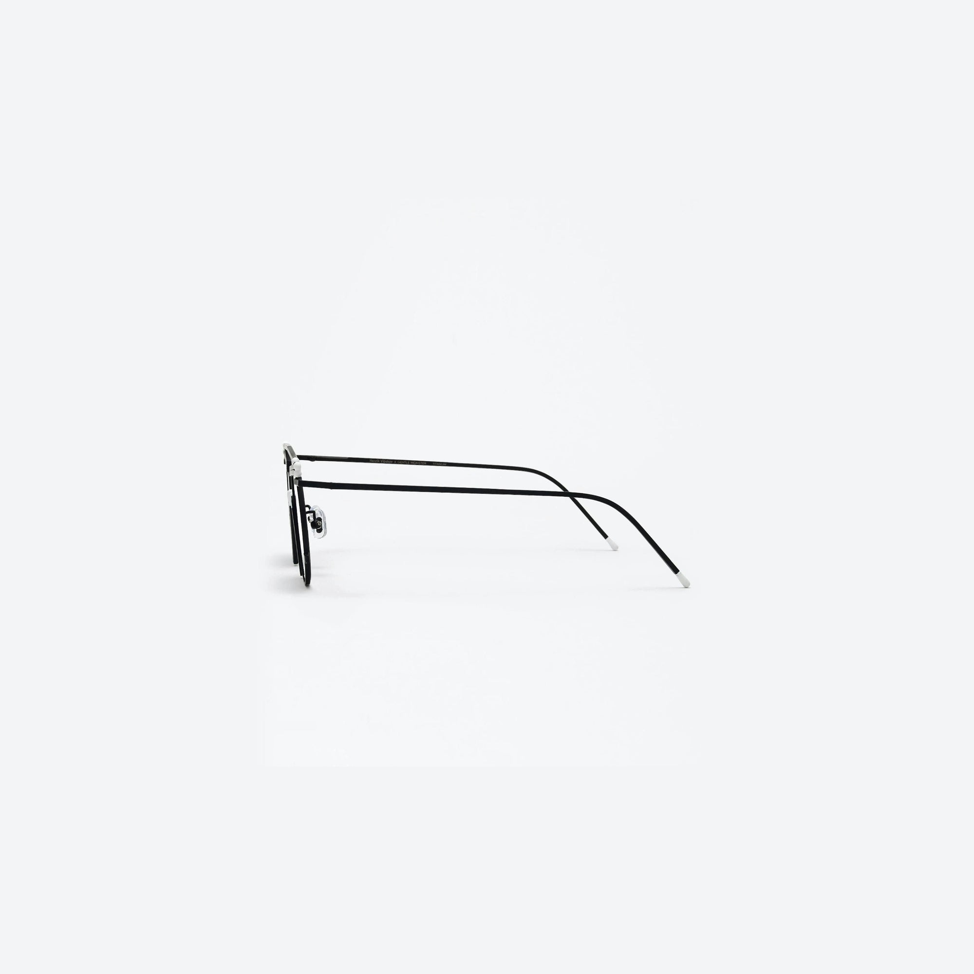 A detailed right view of Gentle Monster Henrik Vibskov - Matches Glasses M01 Black Metal framed Round sunglasses.