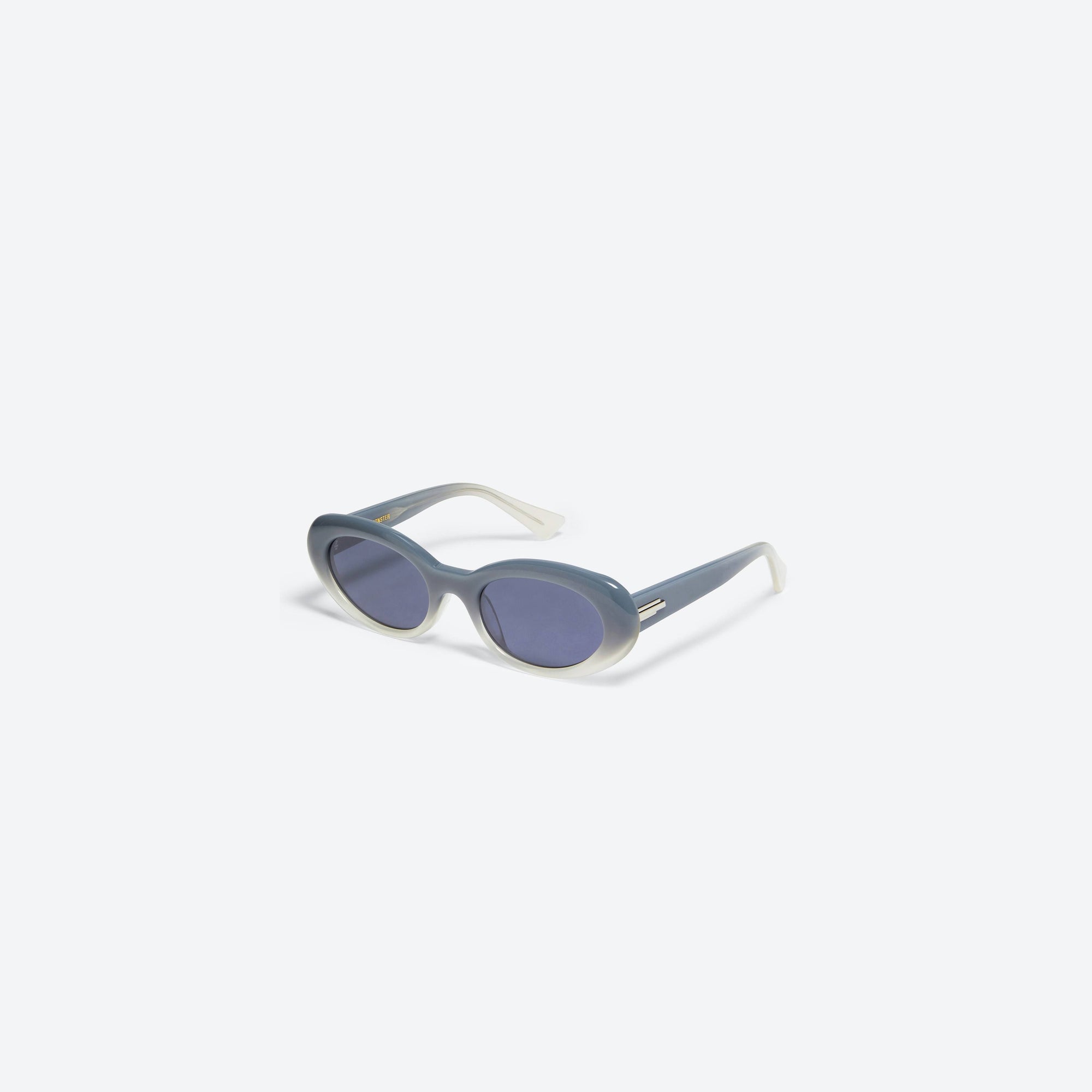45-degree view of Gentle Monster Le IBG1 Blue Acetate framed Oval sunglasses.