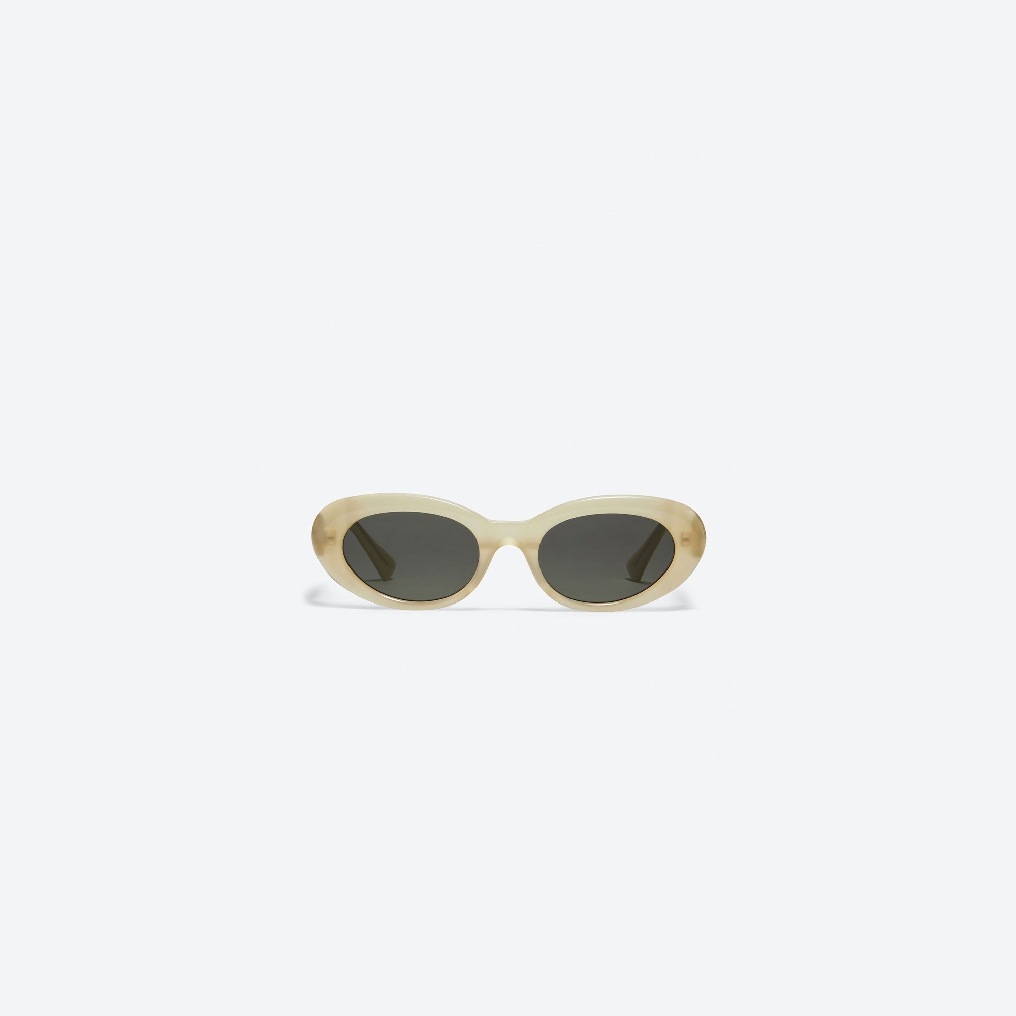 A front view of Gentle Monster Le IC1 Ivory Acetate framed Oval sunglasses.