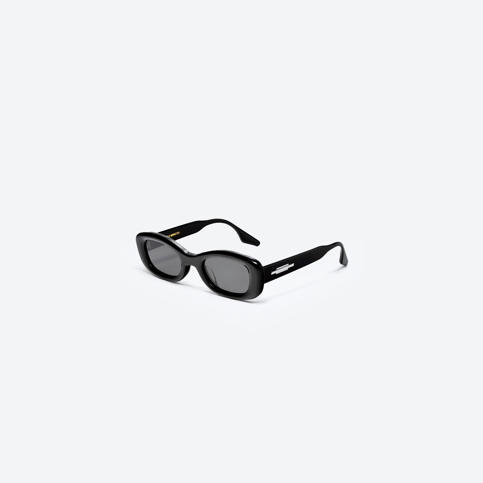 45-degree view of Gentle Monster Tambu 01 Black Acetate framed Square sunglasses.