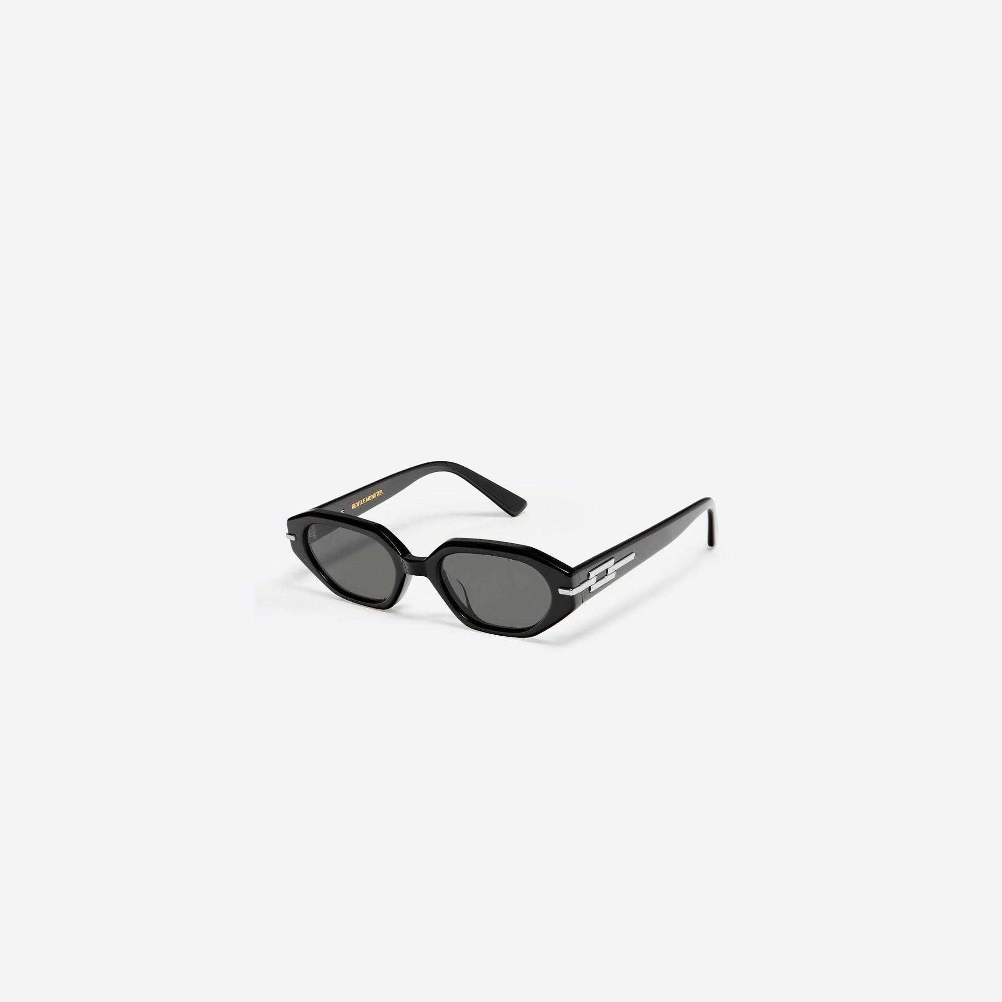 45-degree view of Gentle Monster Corsica 01 Black Acetate framed Oval sunglasses.