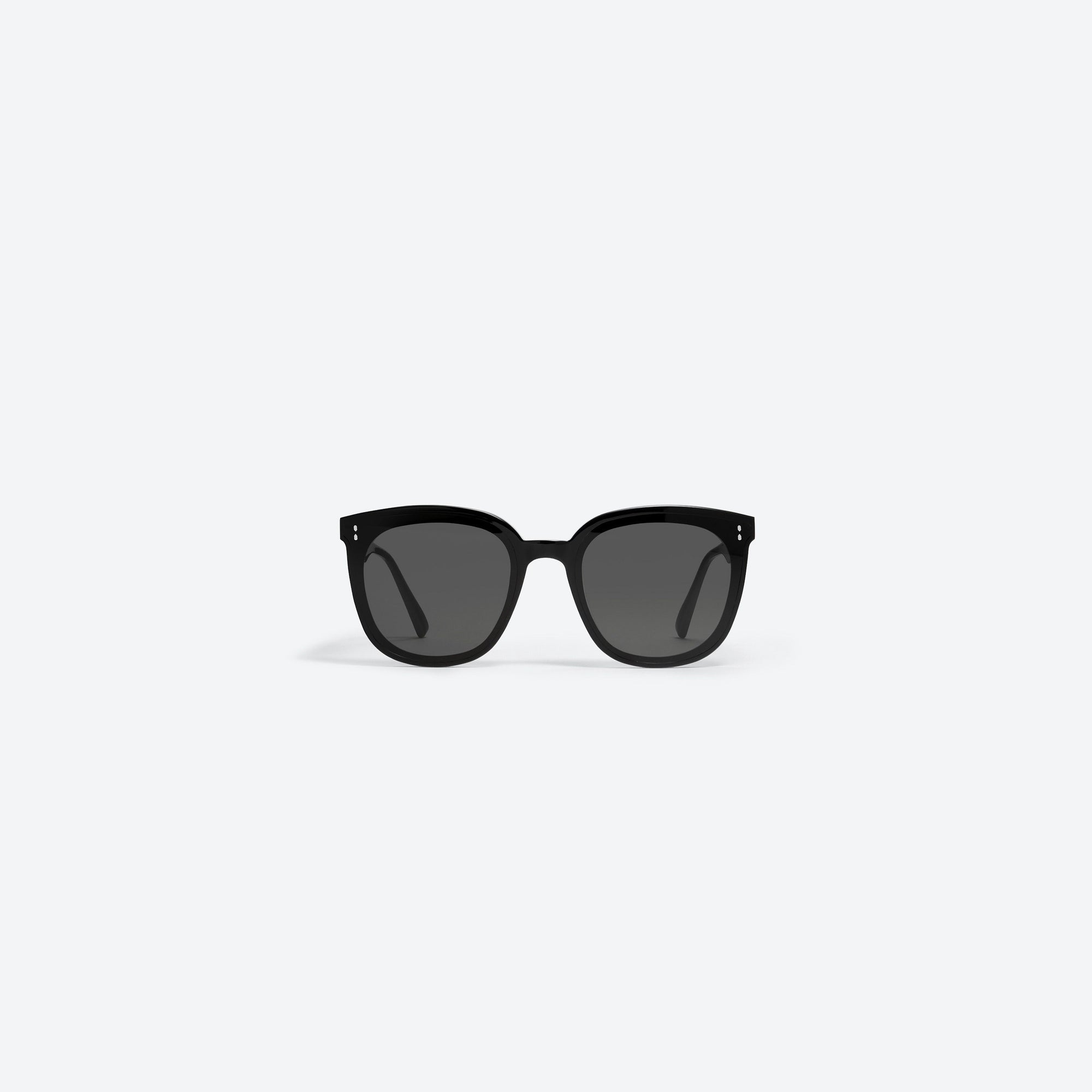 A front view of Gentle Monster Rosy 01 Black Acetate framed Round sunglasses.