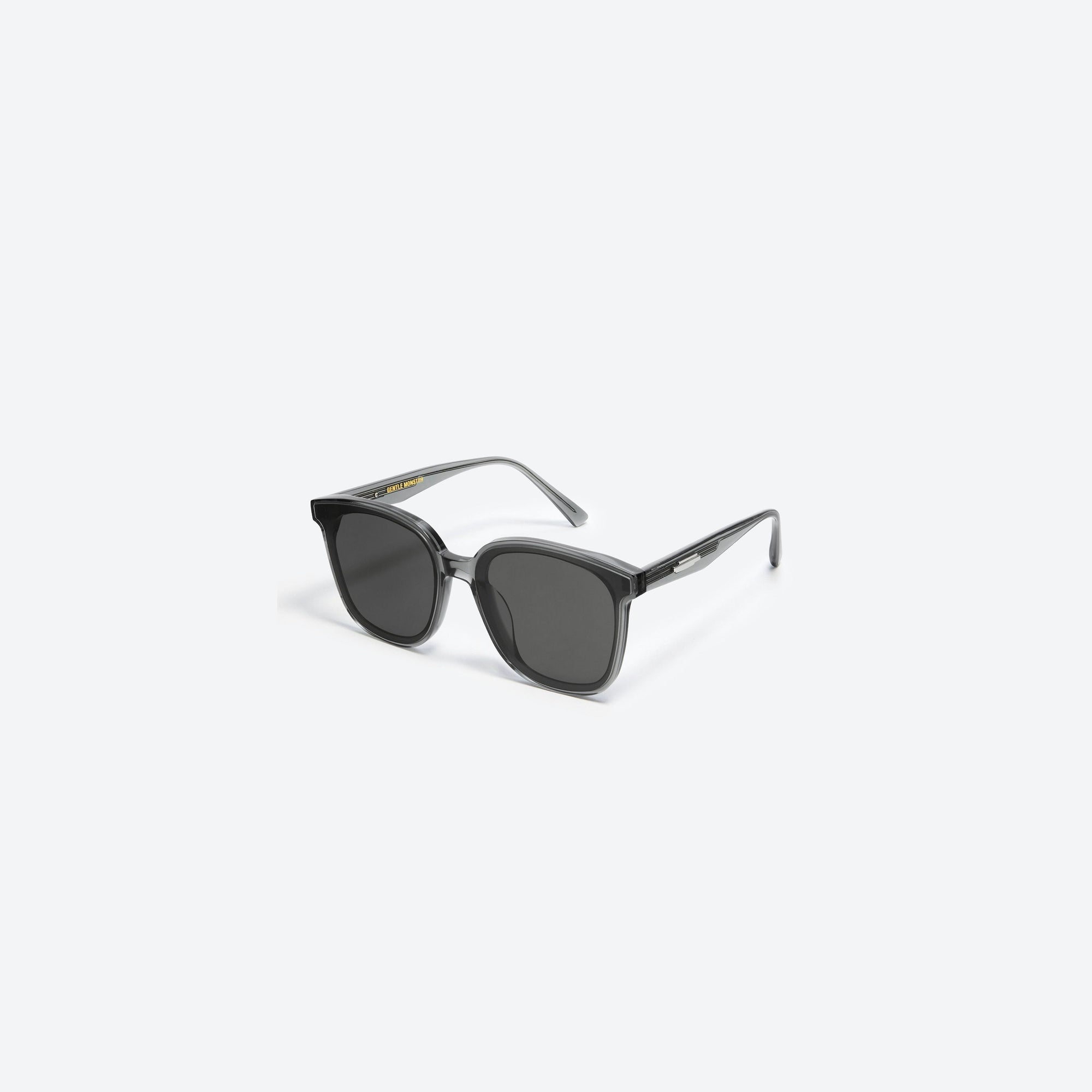 45-degree view of Gentle Monster Jackie G3 Gray Acetate framed Square sunglasses.
