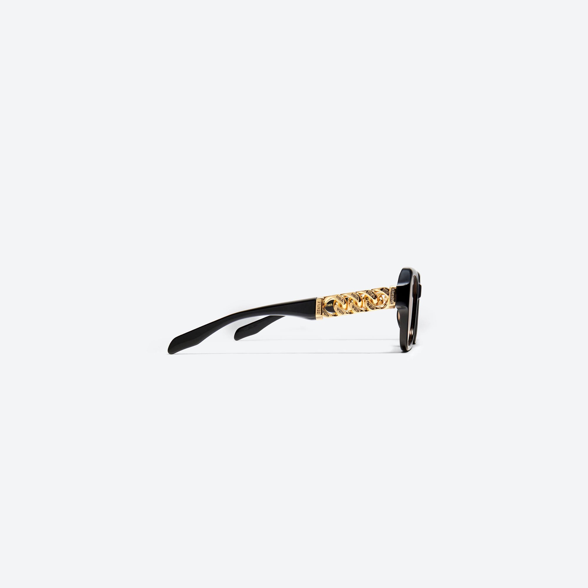 A detailed right view of Gentle Monster HBA - Mother 01(OR) Black Mixed framed Wraparound sunglasses.