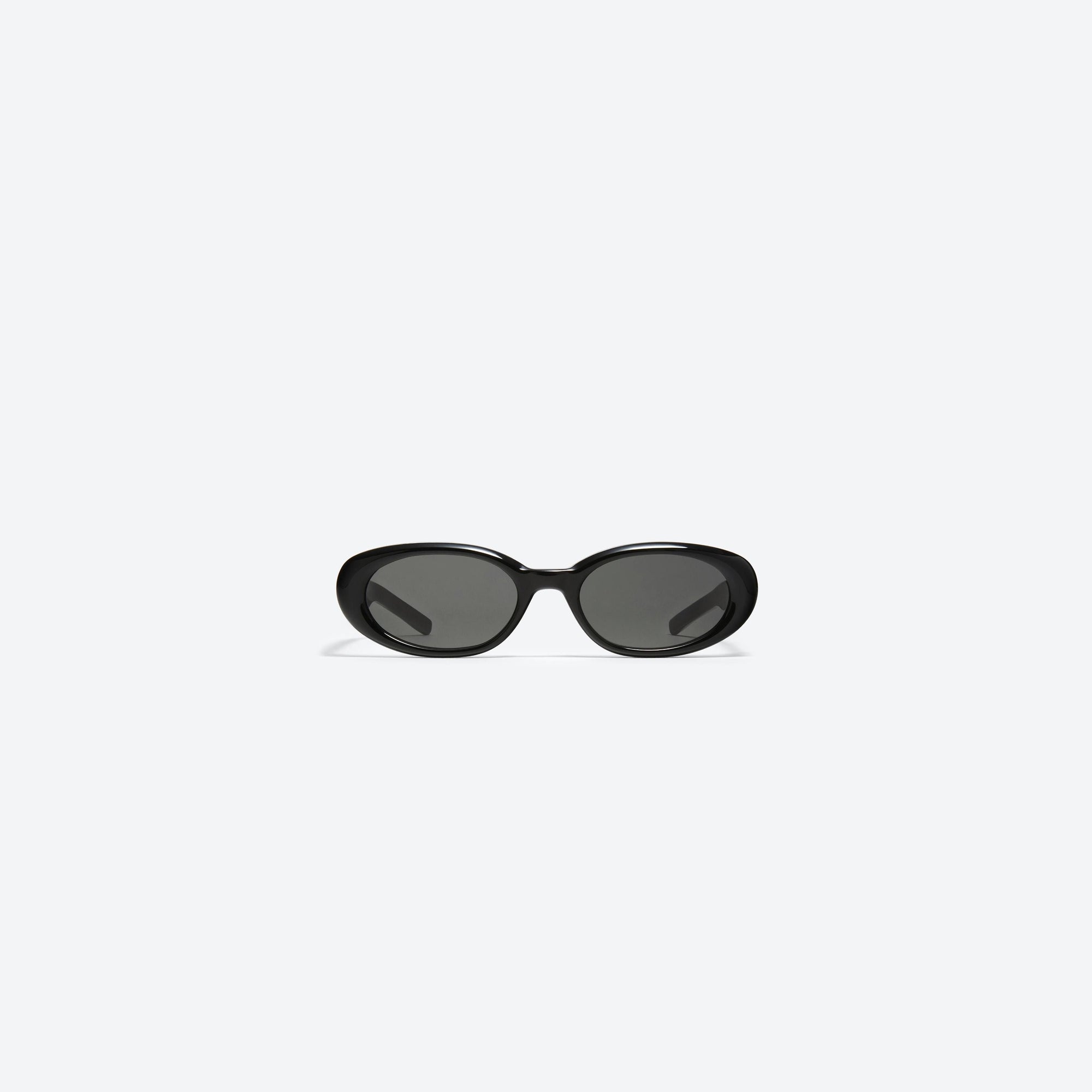A front view of Gentle Monster Bandoneon.S 01 Black Acetate framed Oval sunglasses.