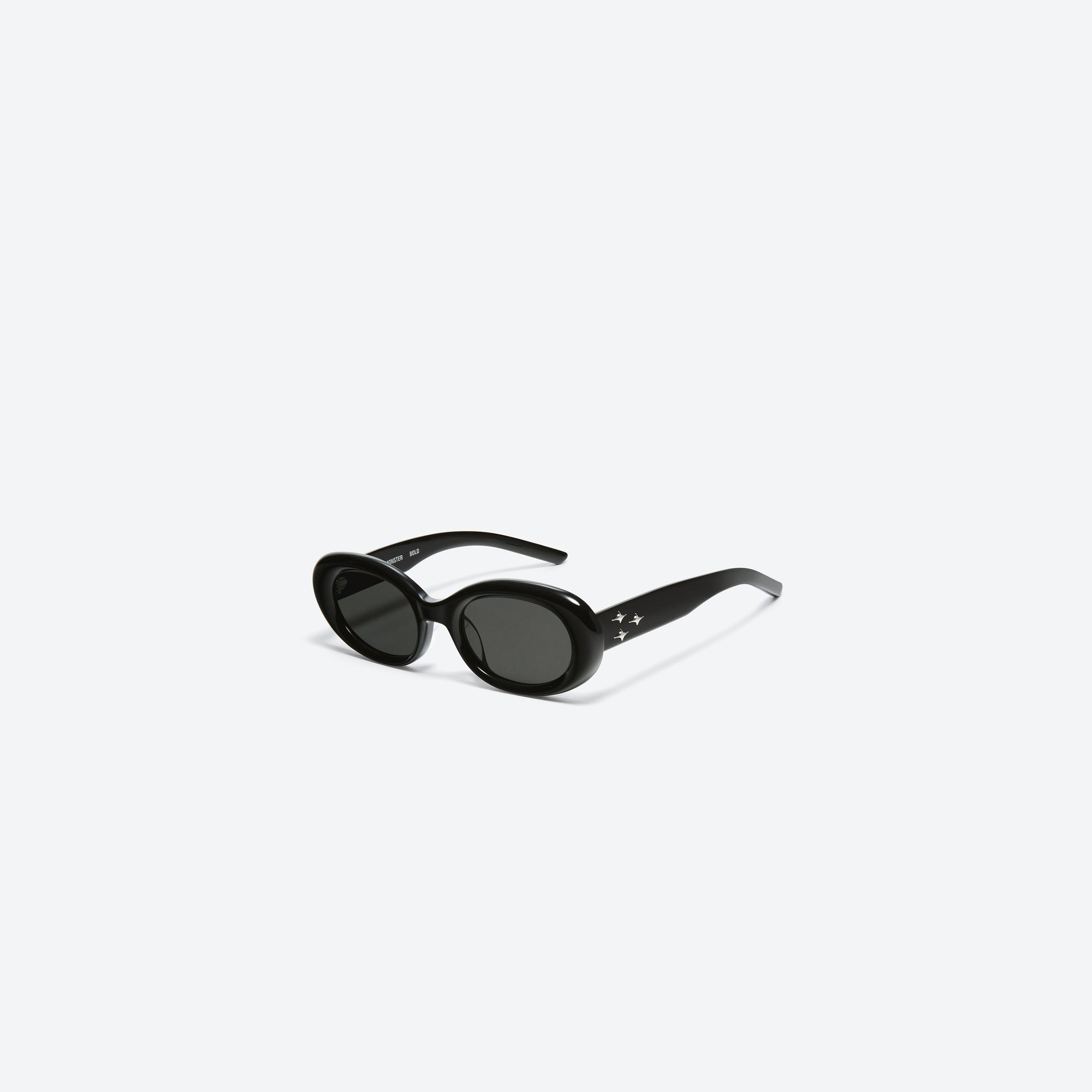 45-degree view of Gentle Monster Eve 01 Black Acetate framed Oval sunglasses.
