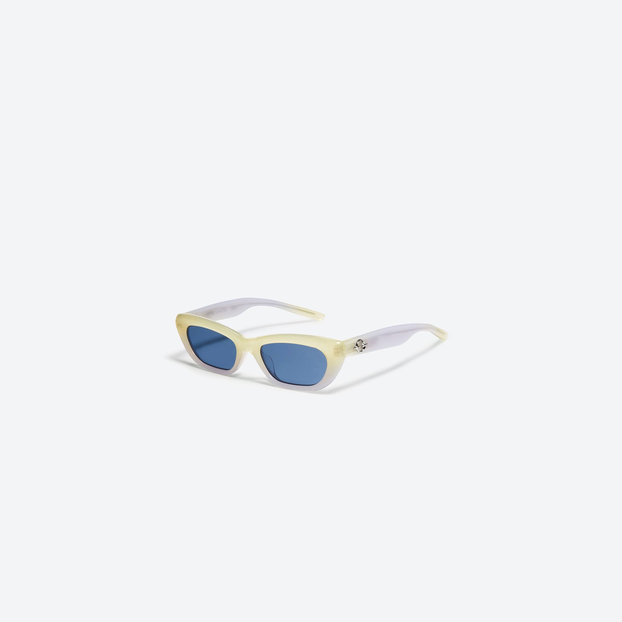45-degree view of Gentle Monster 27And 7 YVG1 Yellow Acetate framed Cat-eye sunglasses.