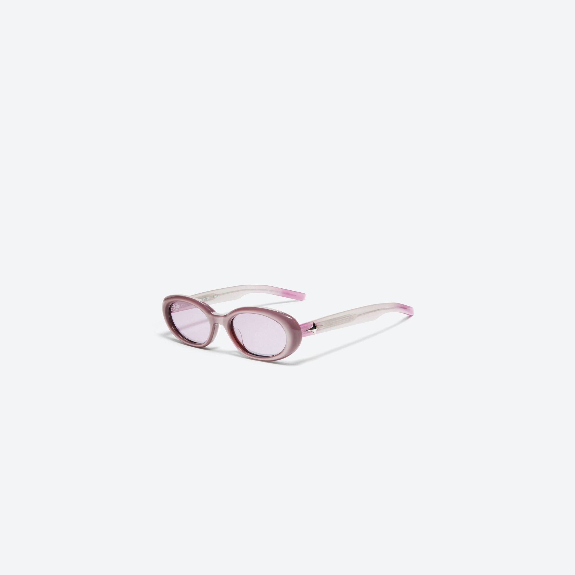 45-degree view of Gentle Monster Bandoneon.S PC5 Pink Acetate framed Oval sunglasses.