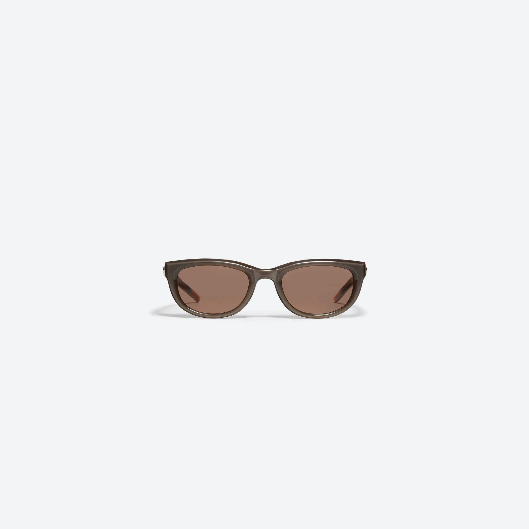 A front view of Gentle Monster Monochrome BRC7 Orange Acetate framed Round sunglasses.