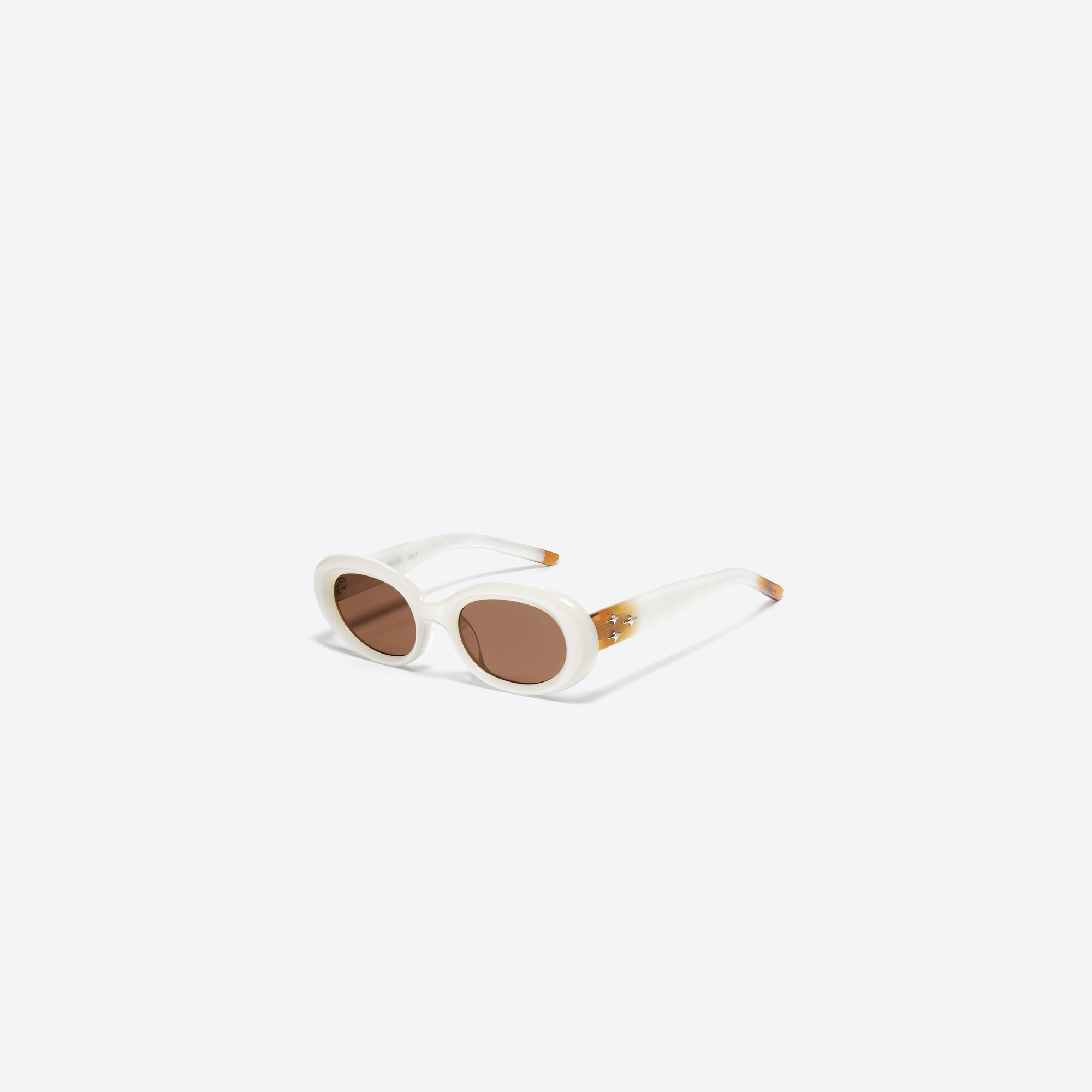 45-degree view of Gentle Monster Eve WC6 White Acetate framed Oval sunglasses.