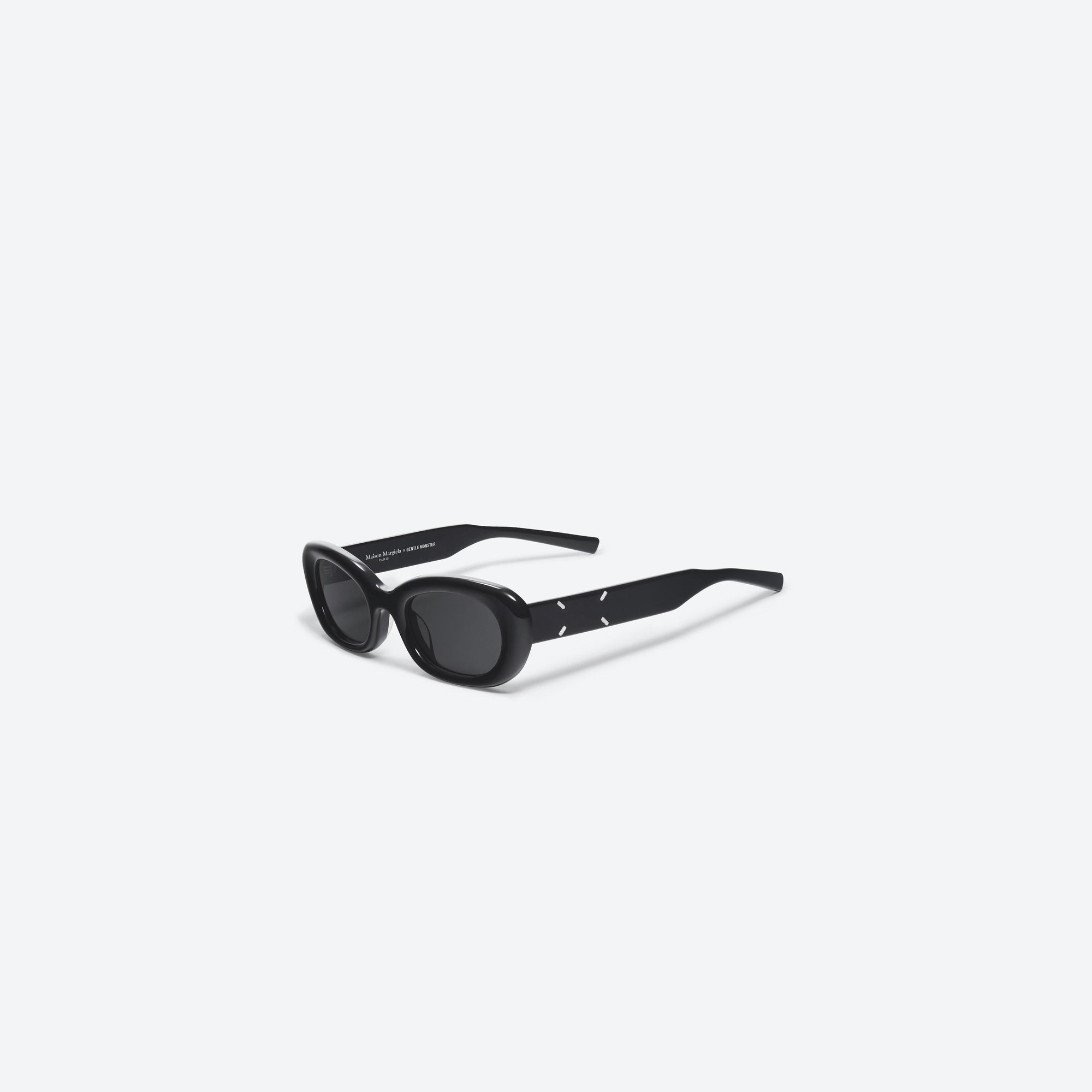 45-degree view of Gentle Monster Maison Margiela - MM004 01 Black Acetate framed Square sunglasses.
