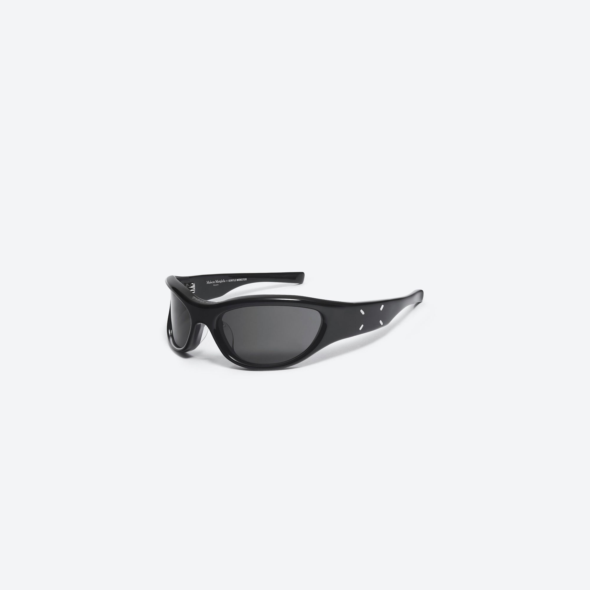 45-degree view of Gentle Monster Maison Margiela - MM003 01 Black Acetate framed Wraparound sunglasses.