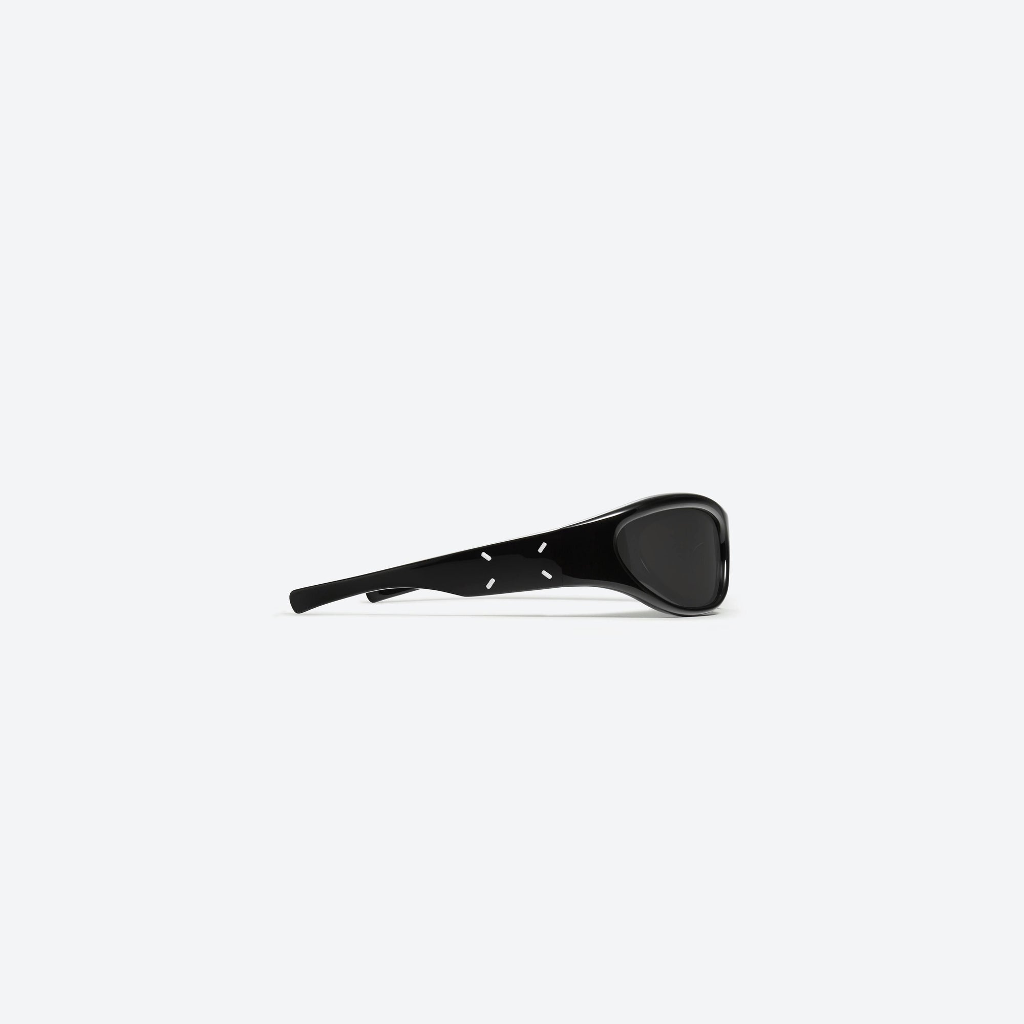 A detailed right view of Gentle Monster Maison Margiela - MM003 01 Black Acetate framed Wraparound sunglasses.