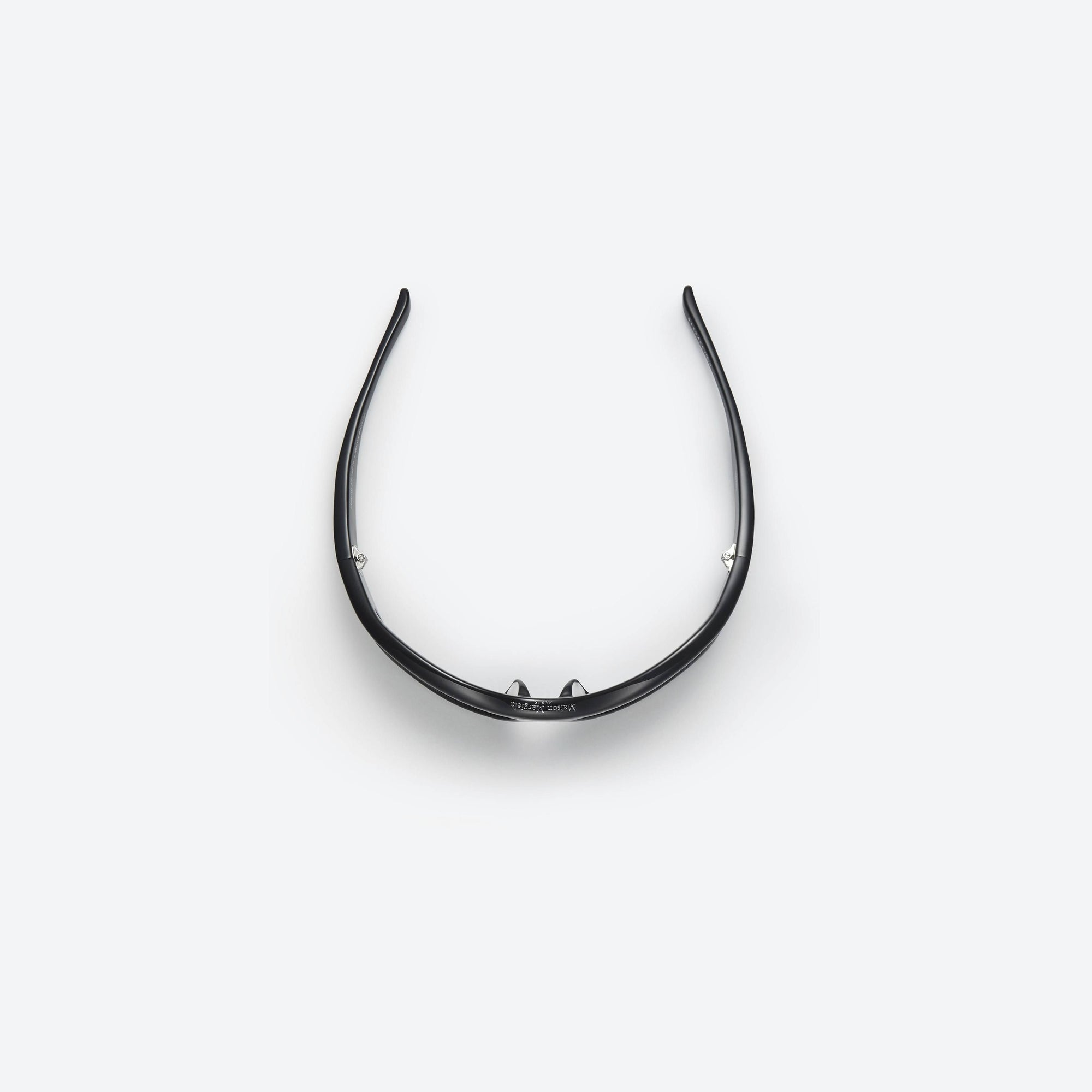 A detailed left view of Gentle Monster Maison Margiela - MM003 01 Black Acetate framed Wraparound sunglasses.