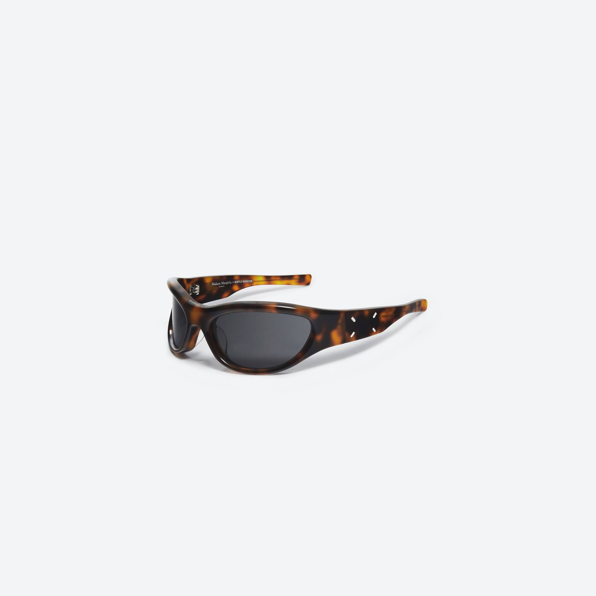 45-degree view of Gentle Monster Maison Margiela - MM003 L2 Tortoise Acetate framed Wraparound sunglasses.