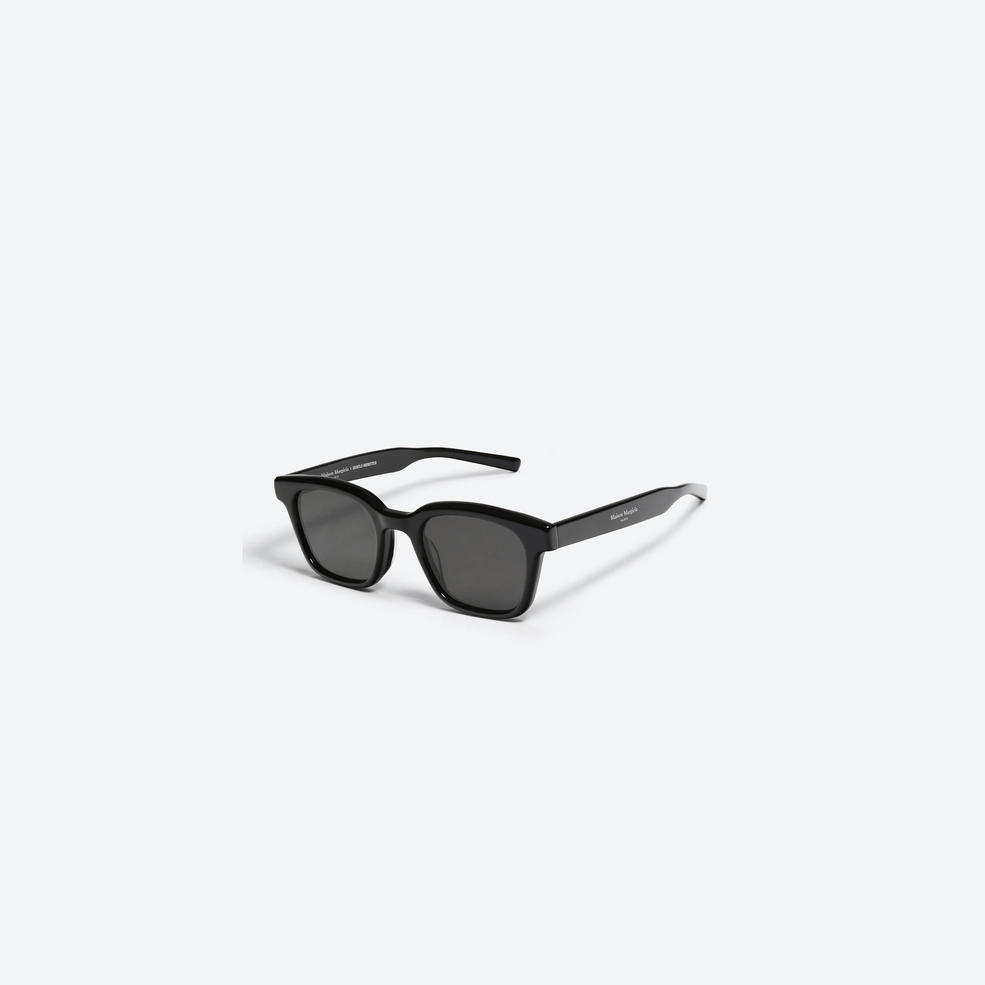 45-degree view of Gentle Monster Maison Margiela - MM006 01 Black Acetate framed Square sunglasses.