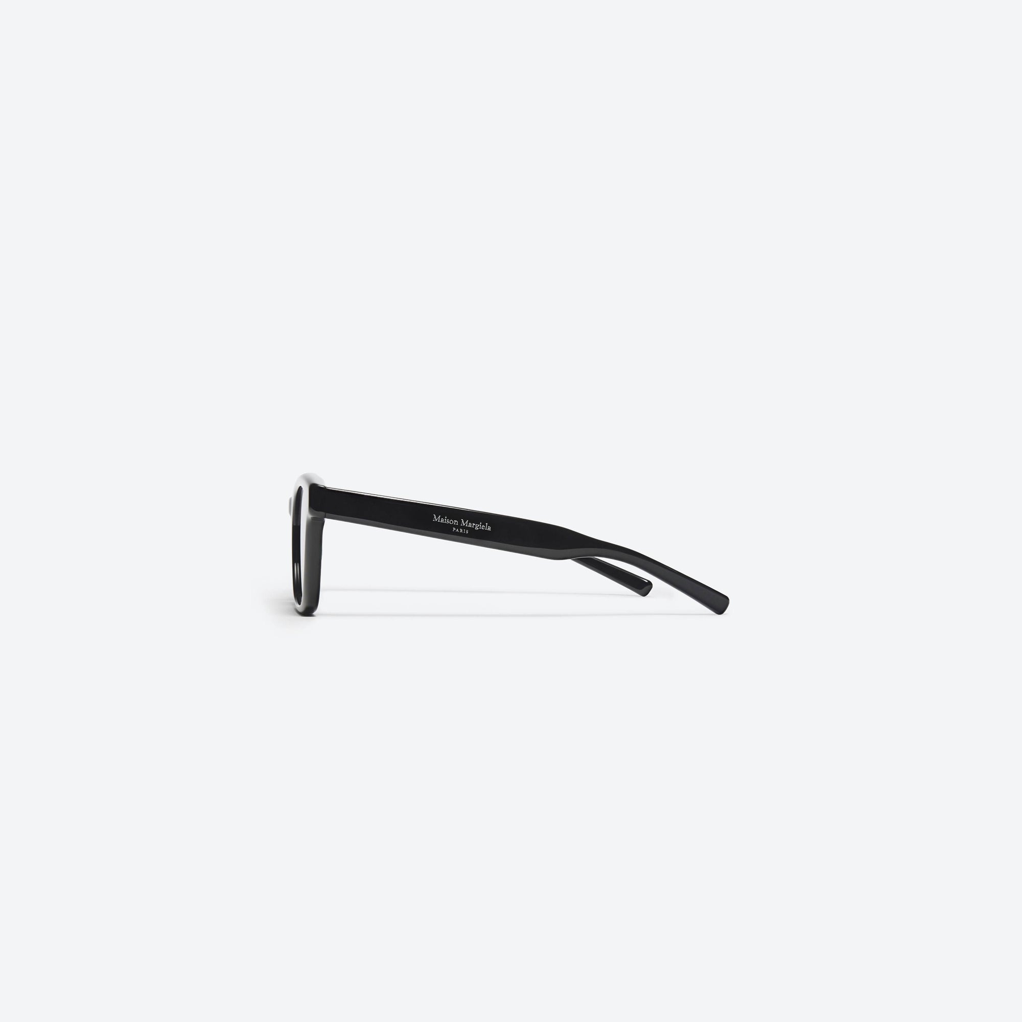 A detailed right view of Gentle Monster Maison Margiela - MM006 01 Black Acetate framed Square sunglasses.