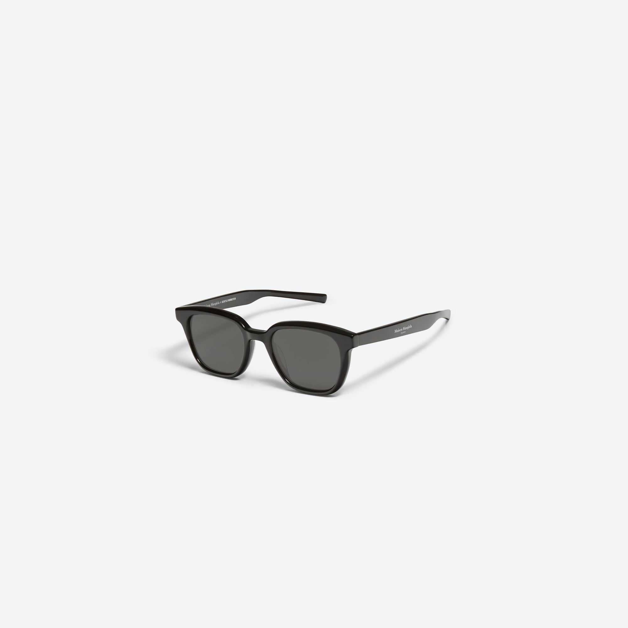 45-degree view of Gentle Monster Maison Margiela - MM007 01 Black Acetate framed Square sunglasses.