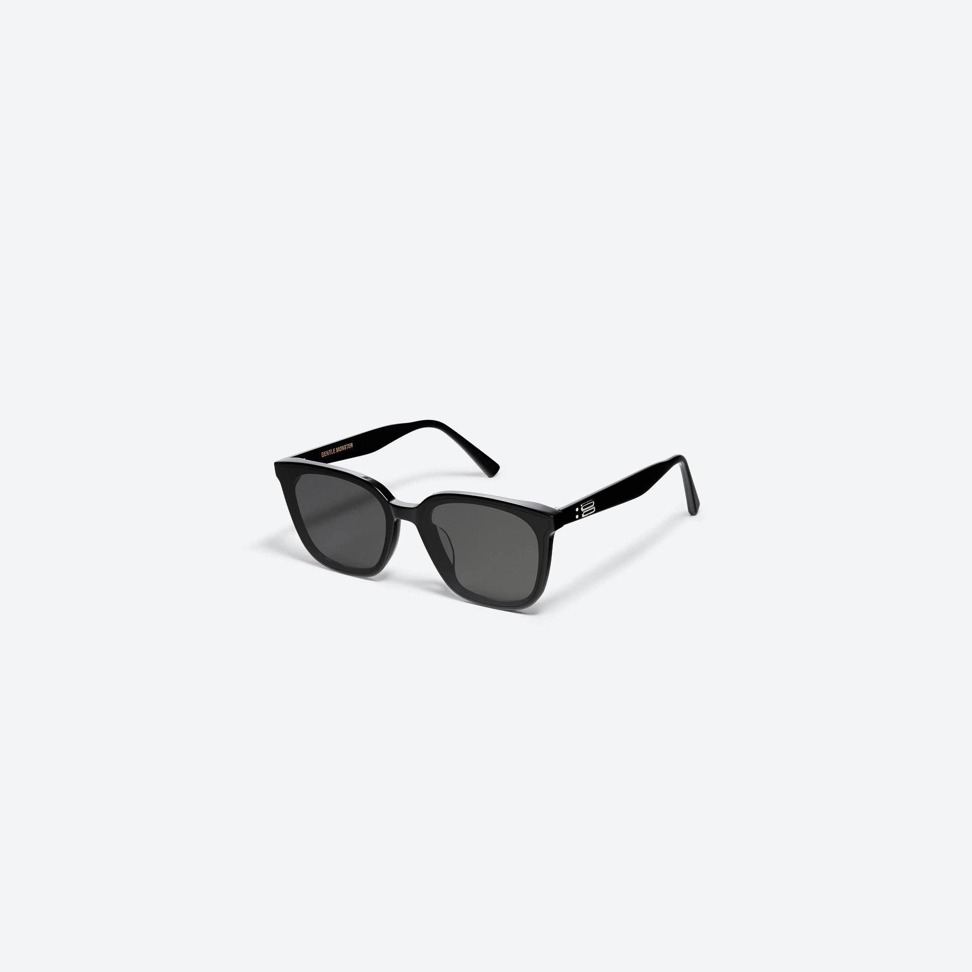 45-degree view of Gentle Monster Tam 01 Black Acetate framed Square sunglasses.