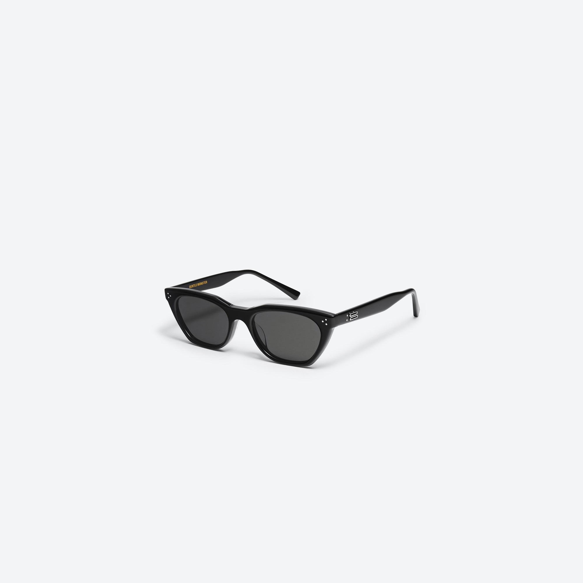 45-degree view of Gentle Monster Cookie 01 Black Acetate framed Cat-eye sunglasses.