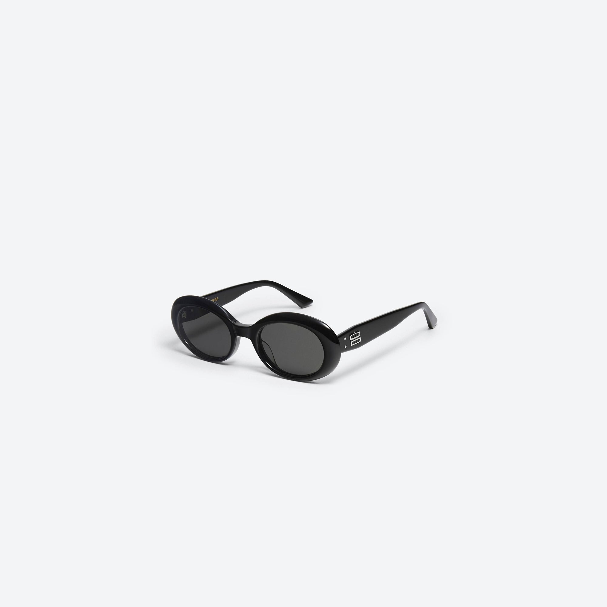 45-degree view of Gentle Monster La Mode 01 Black Acetate framed Oval sunglasses.