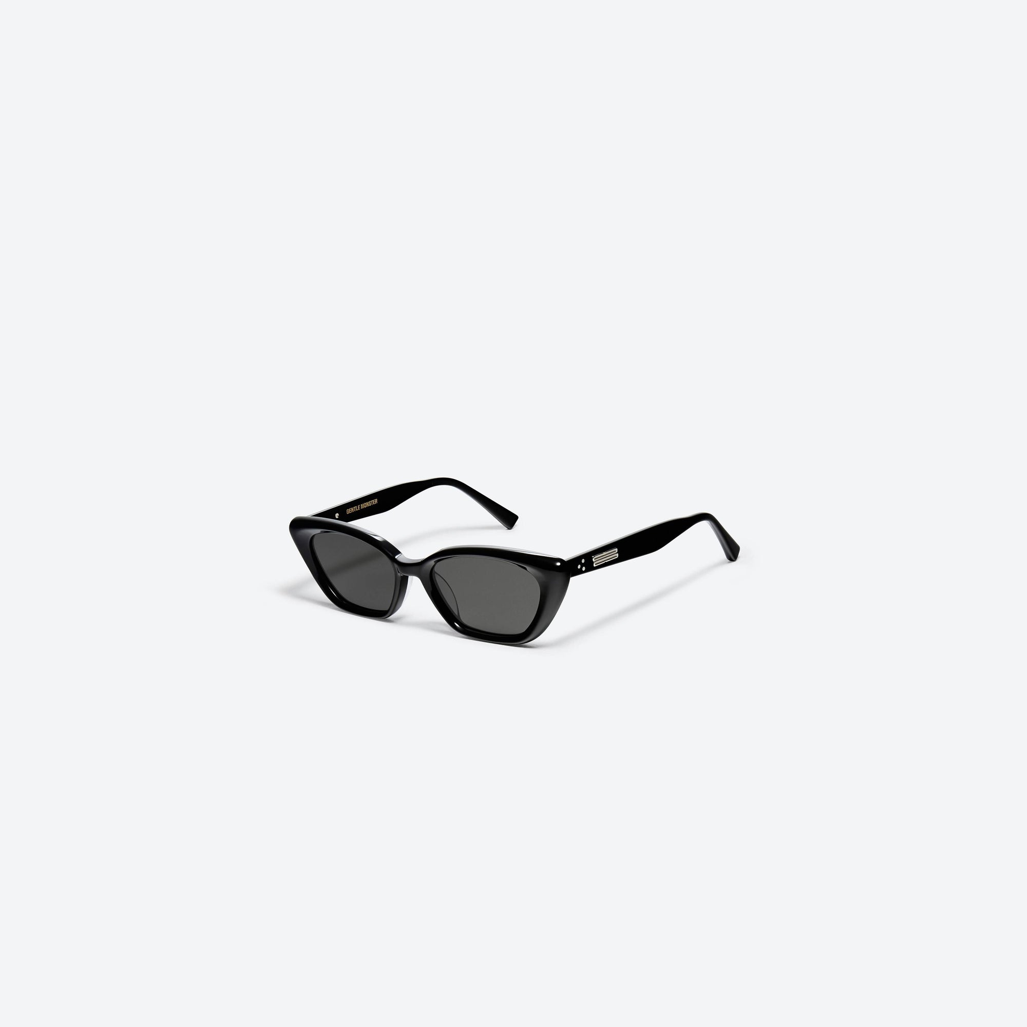 45-degree view of Gentle Monster Terra Cotta 01 Black Acetate framed Cat-eye sunglasses.