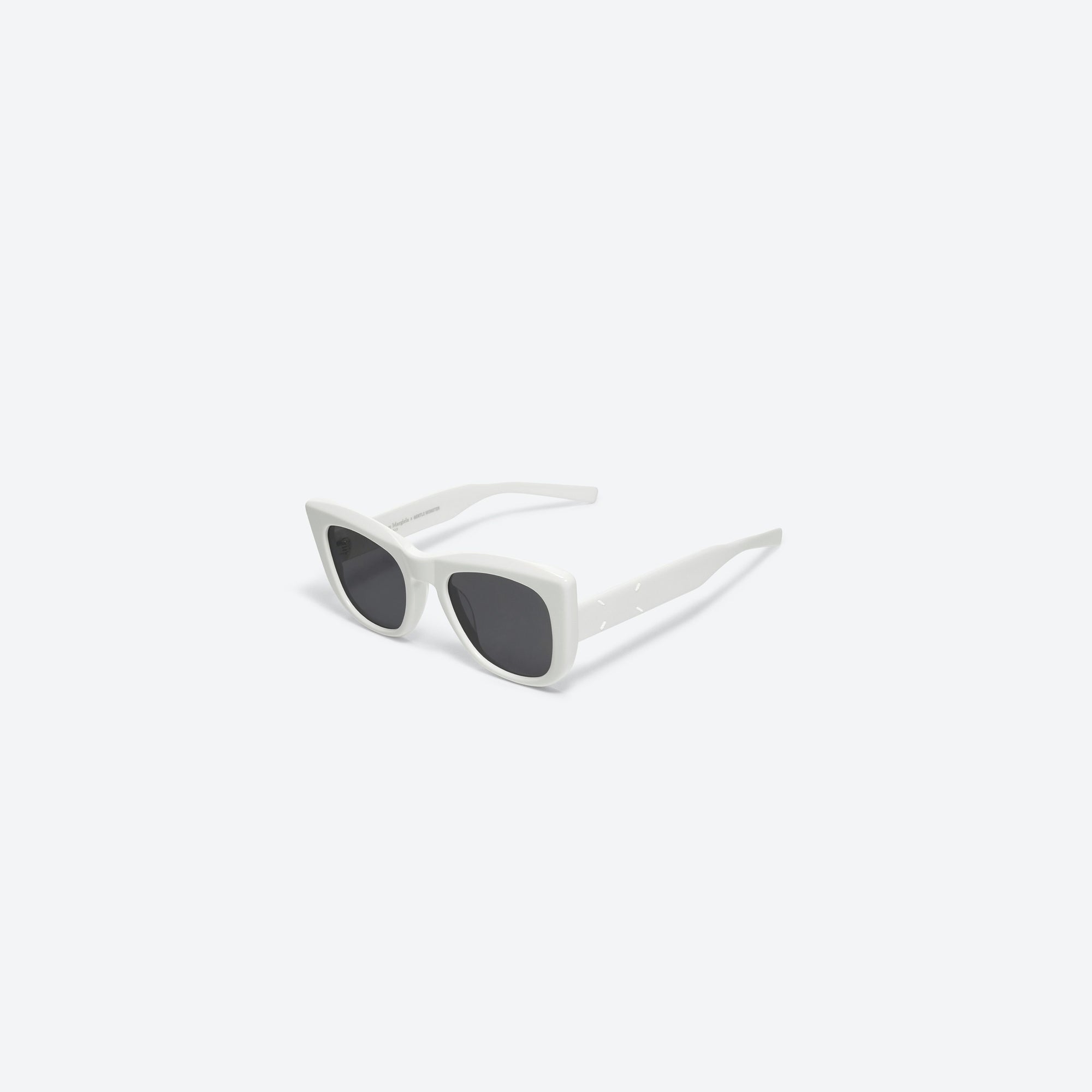 45-degree view of Gentle Monster Maison Margiela - MM008 W2 White Acetate framed Cat-eye sunglasses.