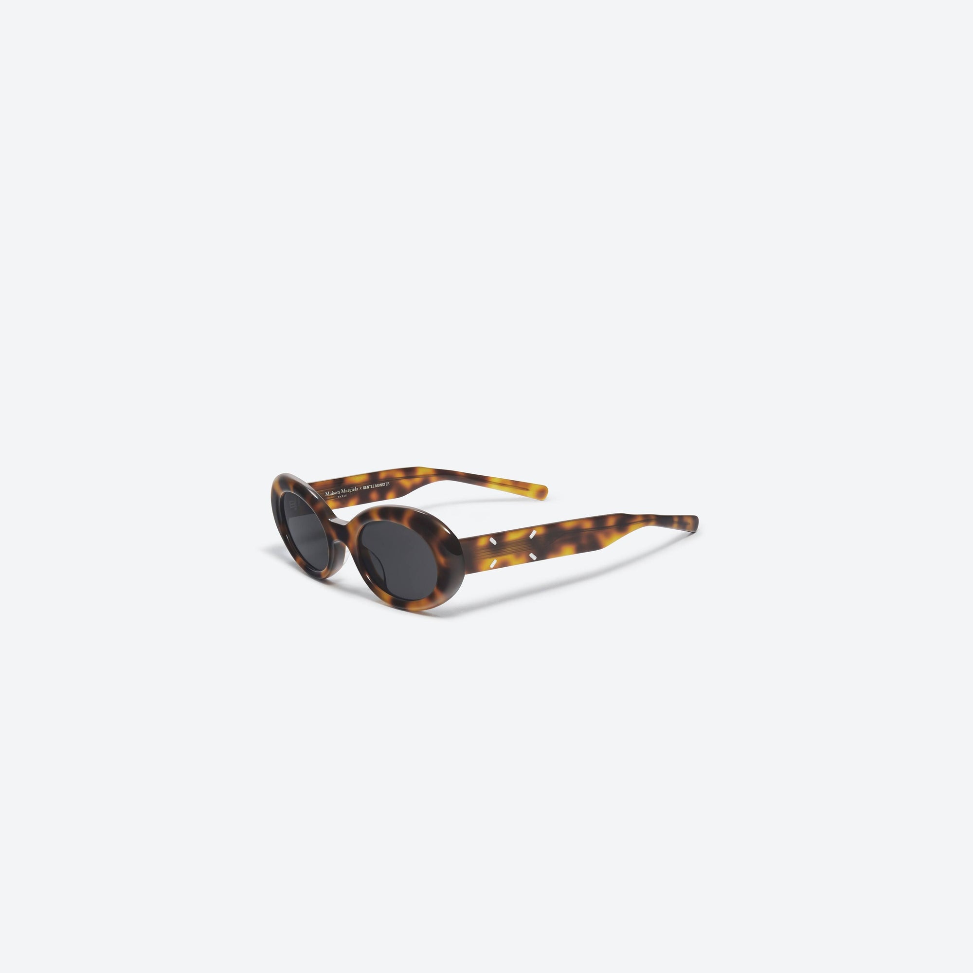 45-degree view of Gentle Monster Maison Margiela - MM005 L2 Tortoise Acetate framed Oval sunglasses.