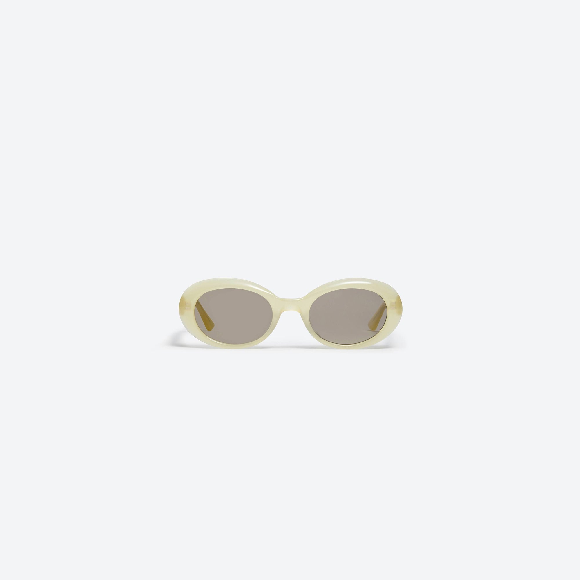A front view of Gentle Monster La Mode YC8 Yellow Acetate framed Oval sunglasses.