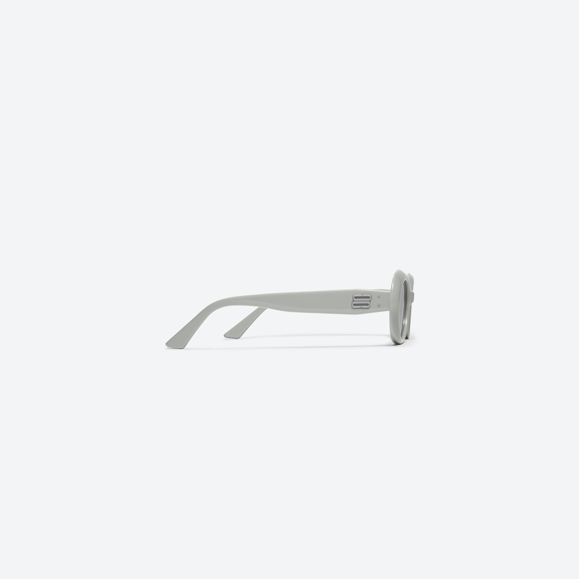 A detailed right view of Gentle Monster La Mode G6 Gray Acetate framed Oval sunglasses.