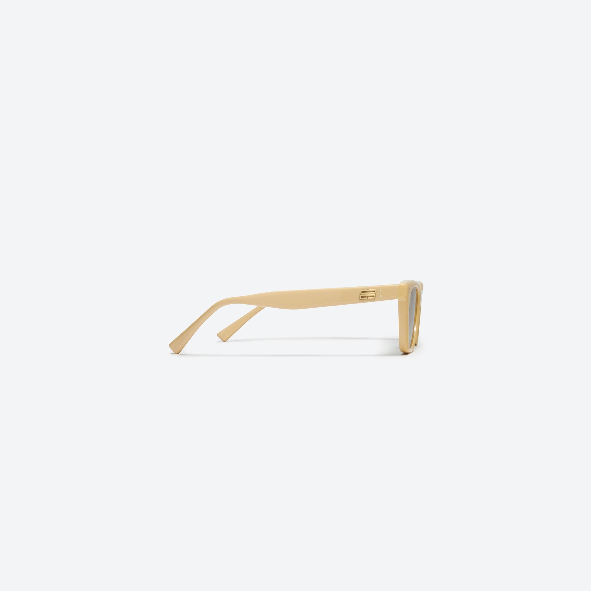 A detailed right view of Gentle Monster Cookie Y6 Yellow Acetate framed Cat-eye sunglasses.