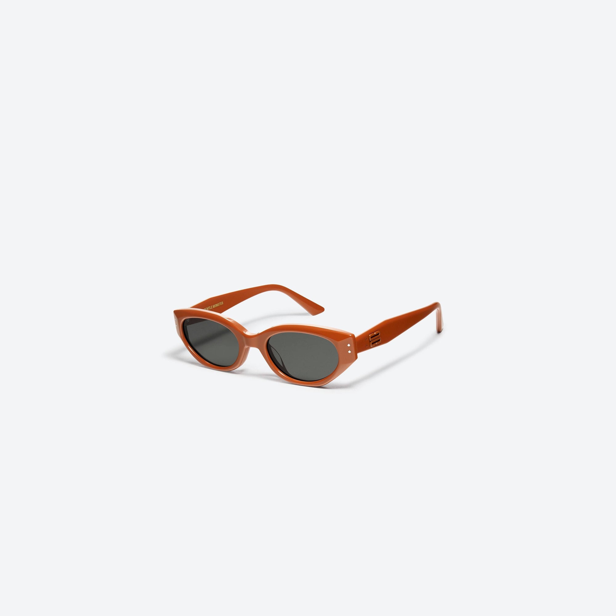 45-degree view of Gentle Monster Rococo OR2 Orange Acetate framed Cat-eye sunglasses.