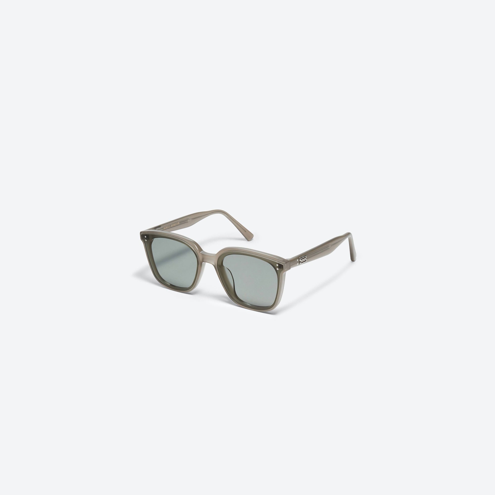 45-degree view of Gentle Monster Queen K2 Green Acetate framed Square sunglasses.