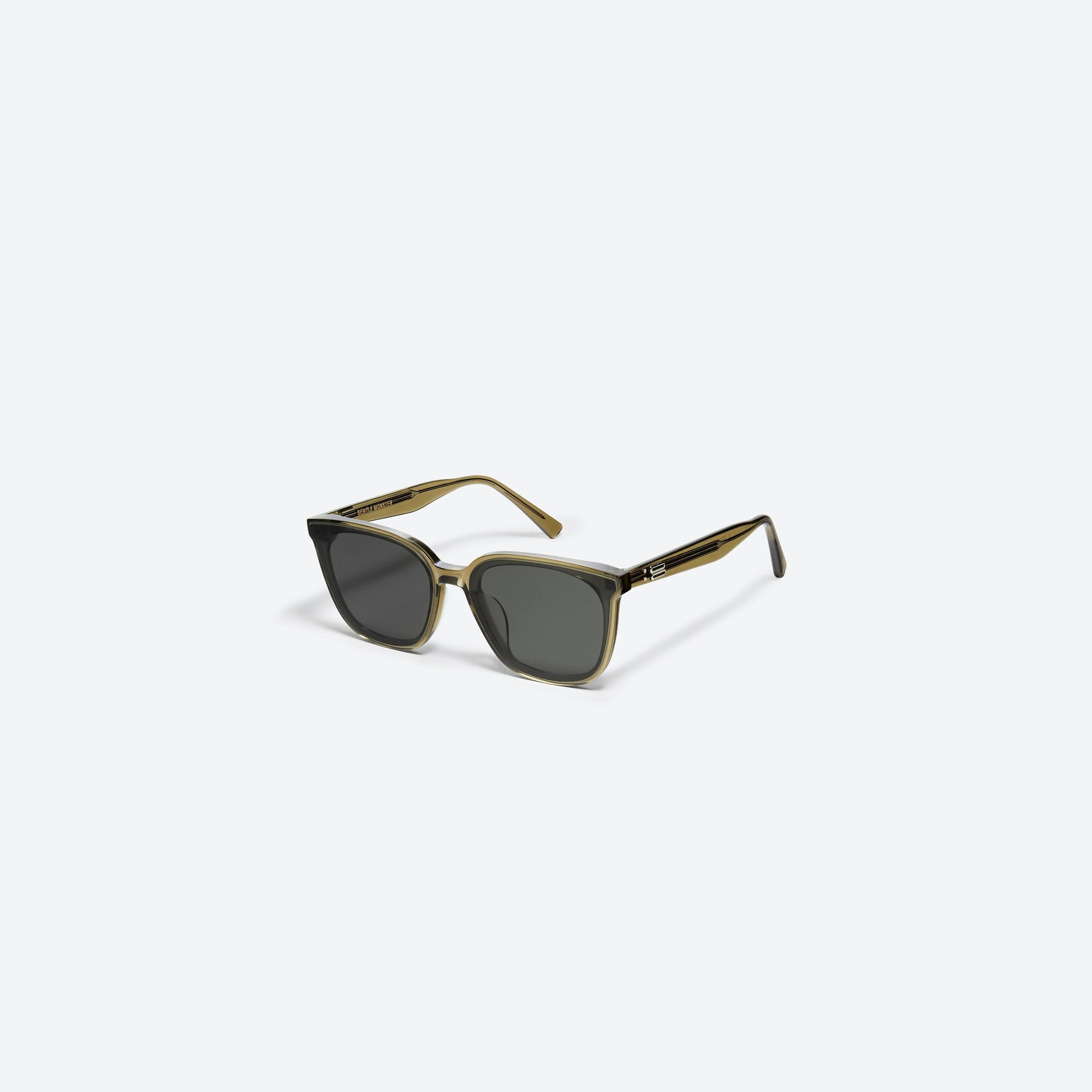45-degree view of Gentle Monster Tam KC1 Green Acetate framed Square sunglasses.
