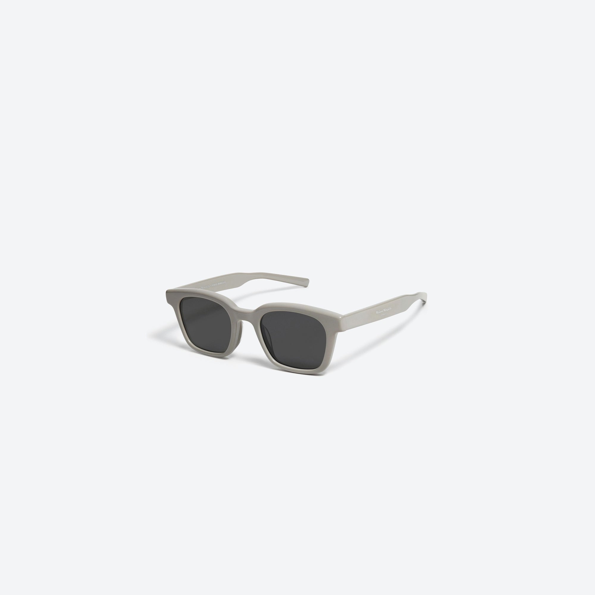 45-degree view of Gentle Monster Maison Margiela - MM006 G10 Gray Acetate framed Square sunglasses.