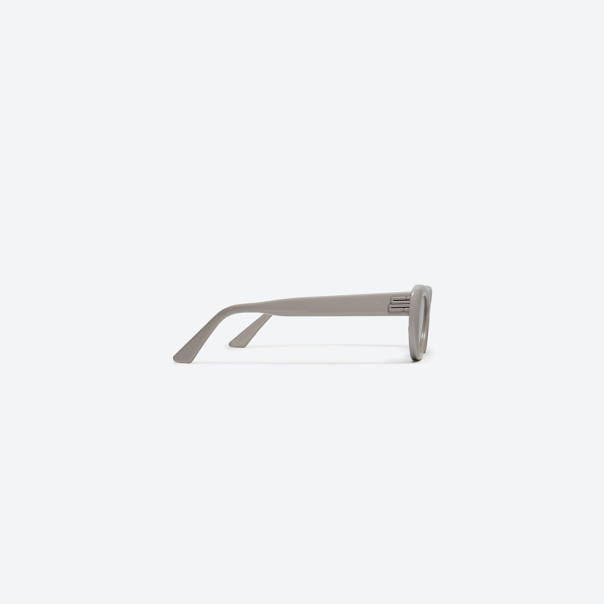 A detailed right view of Gentle Monster Conic G10 Similar Gray Acetate framed Cat-eye sunglasses.