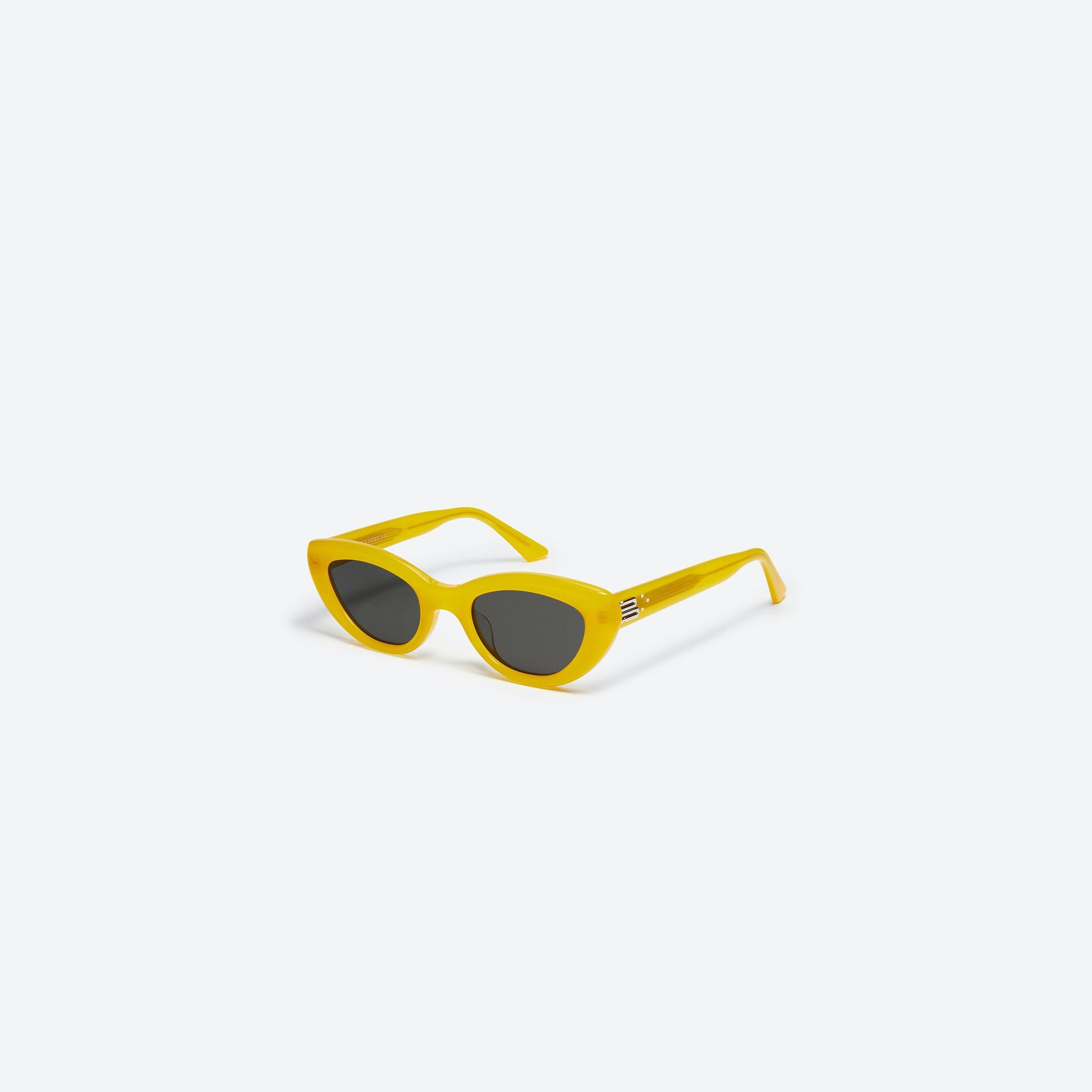 45-degree view of Gentle Monster Conic YC7 Yellow Acetate framed Cat-eye sunglasses.