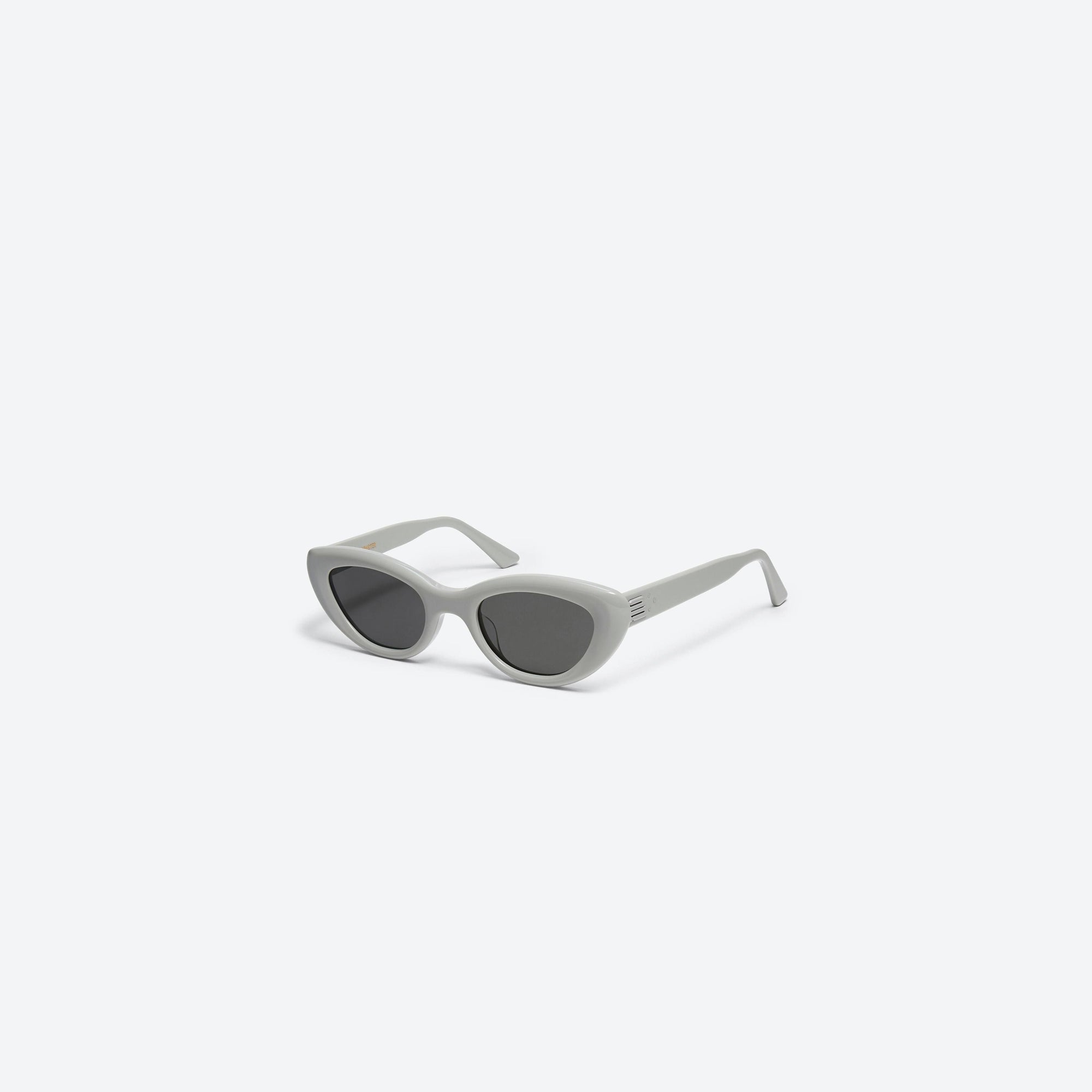 45-degree view of Gentle Monster Conic G6 Gray Acetate framed Cat-eye sunglasses.