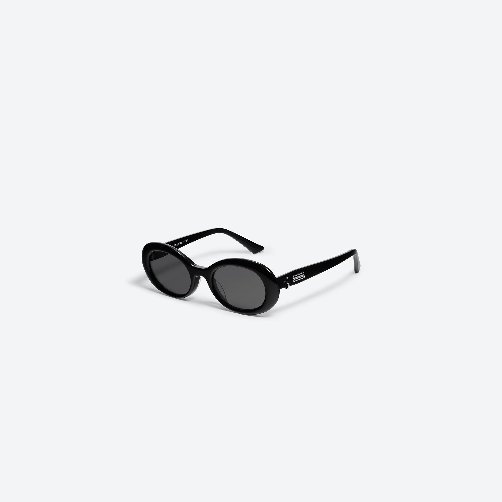 45-degree view of Gentle Monster KUN - 0003 01 Black Acetate framed Oval sunglasses.