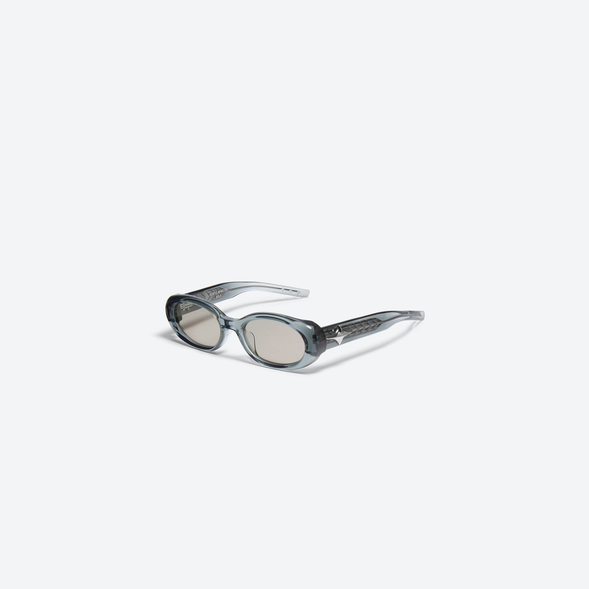 45-degree view of Gentle Monster Orah GC5 Gray Acetate framed Oval sunglasses.